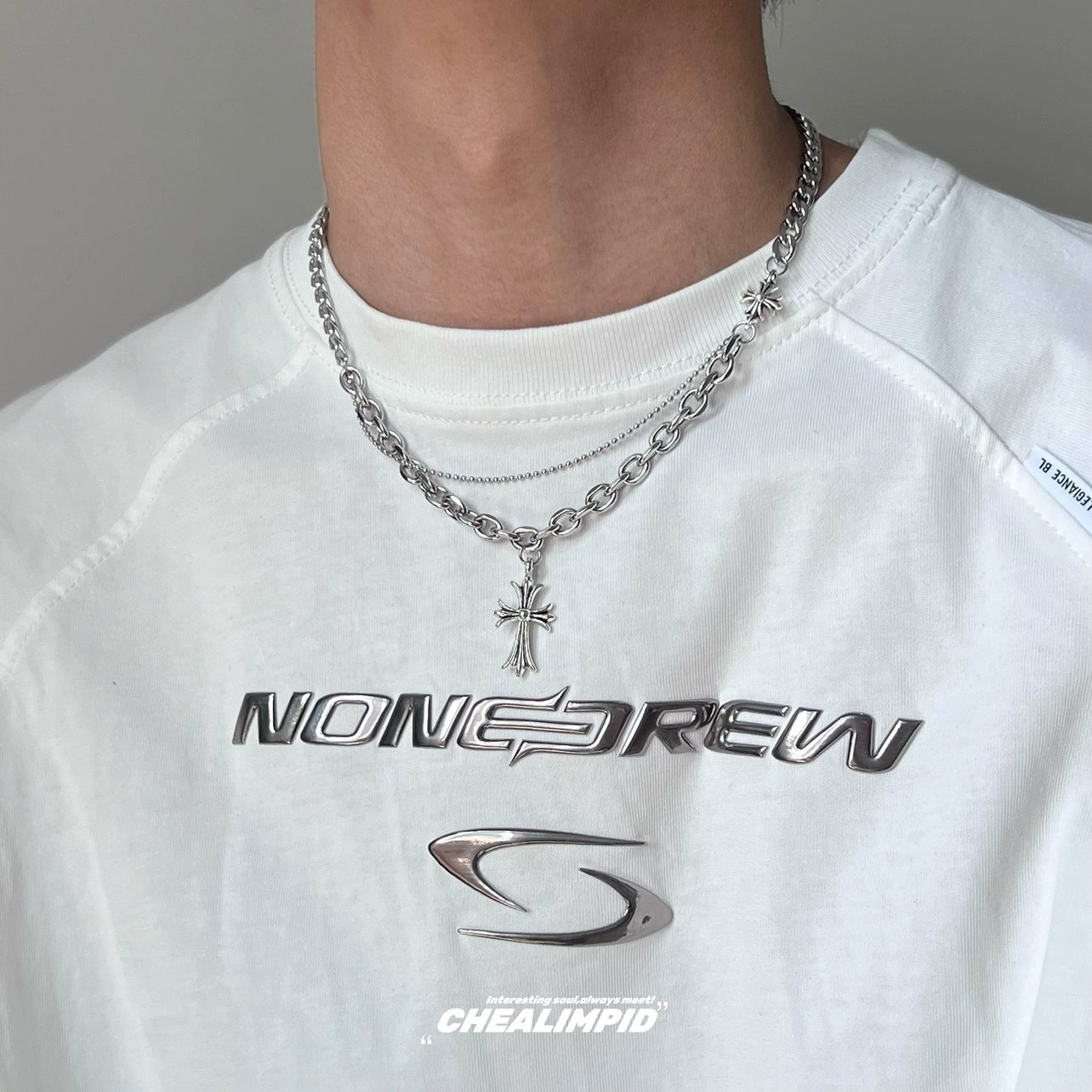 Discover Sanhoostudio’s cross double-layer titanium necklace—sturdy titanium construction paired with layered chains for a versatile unisex accessory suitable for casual and dressy street looks.