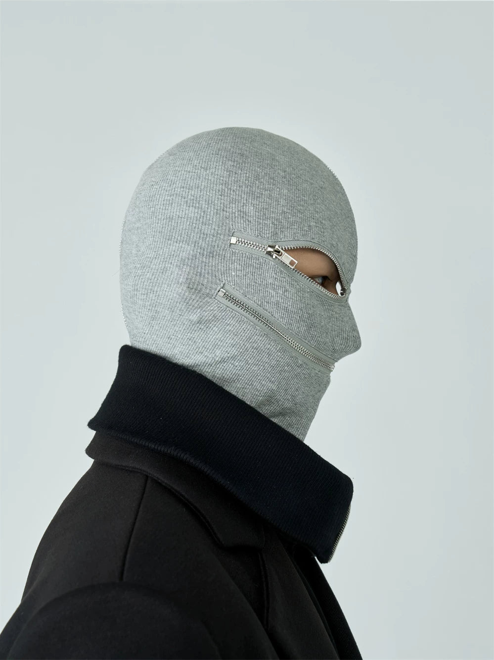 Sanhoostudio black and white zip-up hood mask designed for unisex streetwear styling. Featuring a full zip closure, foldable structure, and warm layered design for casual spring wear.
