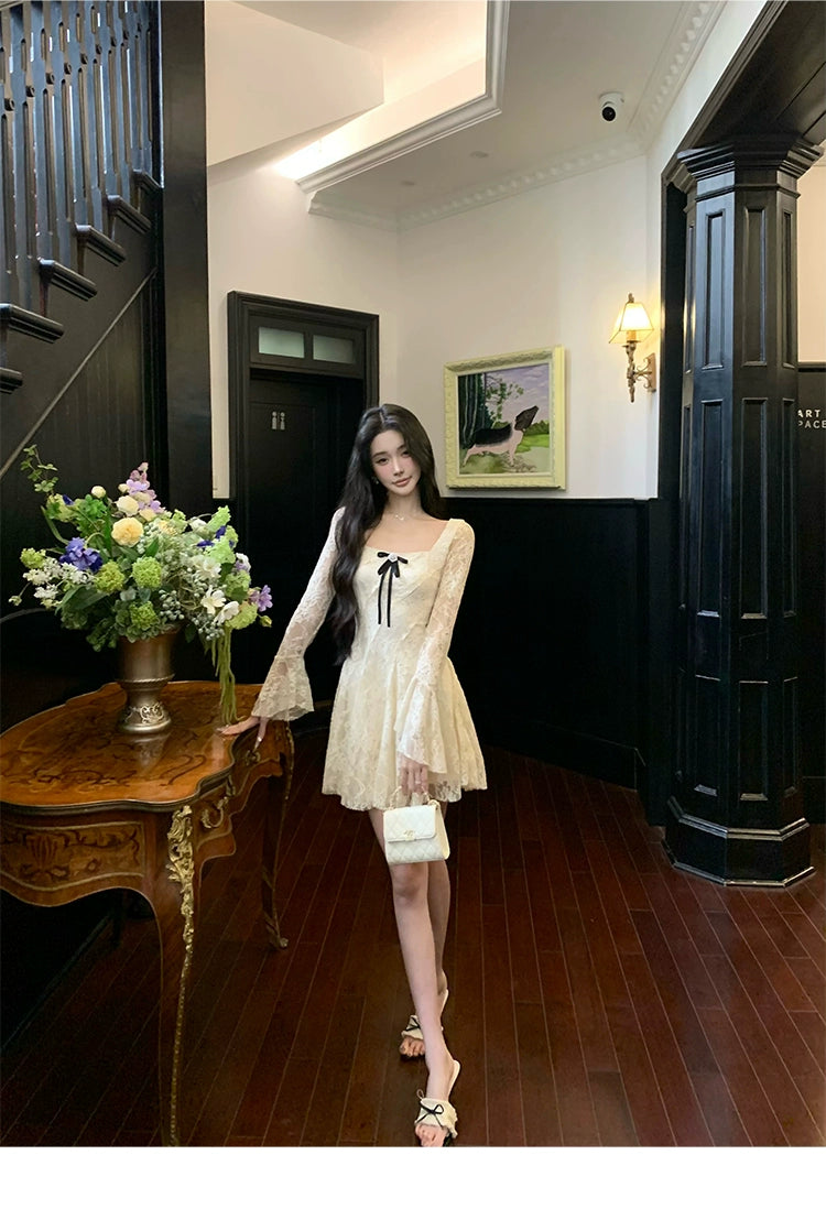 Sanhoostudio presents the Lace Bow Long Sleeve Dress, a charming piece with lace and bow accents, perfect for birthdays and autumn gatherings.