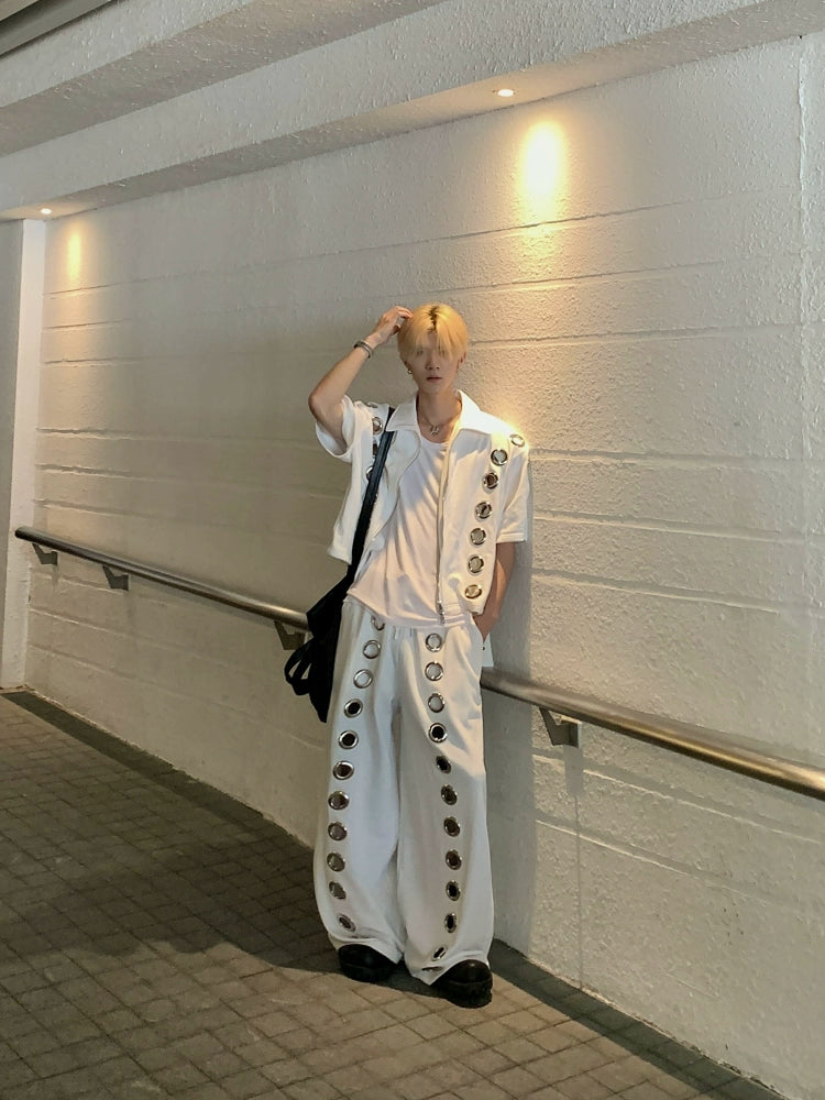 The Sanhoostudio two-piece set combines a cropped hoodie with metal ring hollow details and a matching bottom for a coordinated high street look. With its relaxed fit and edgy design, this set delivers both comfort and standout individuality for streetwear enthusiasts.