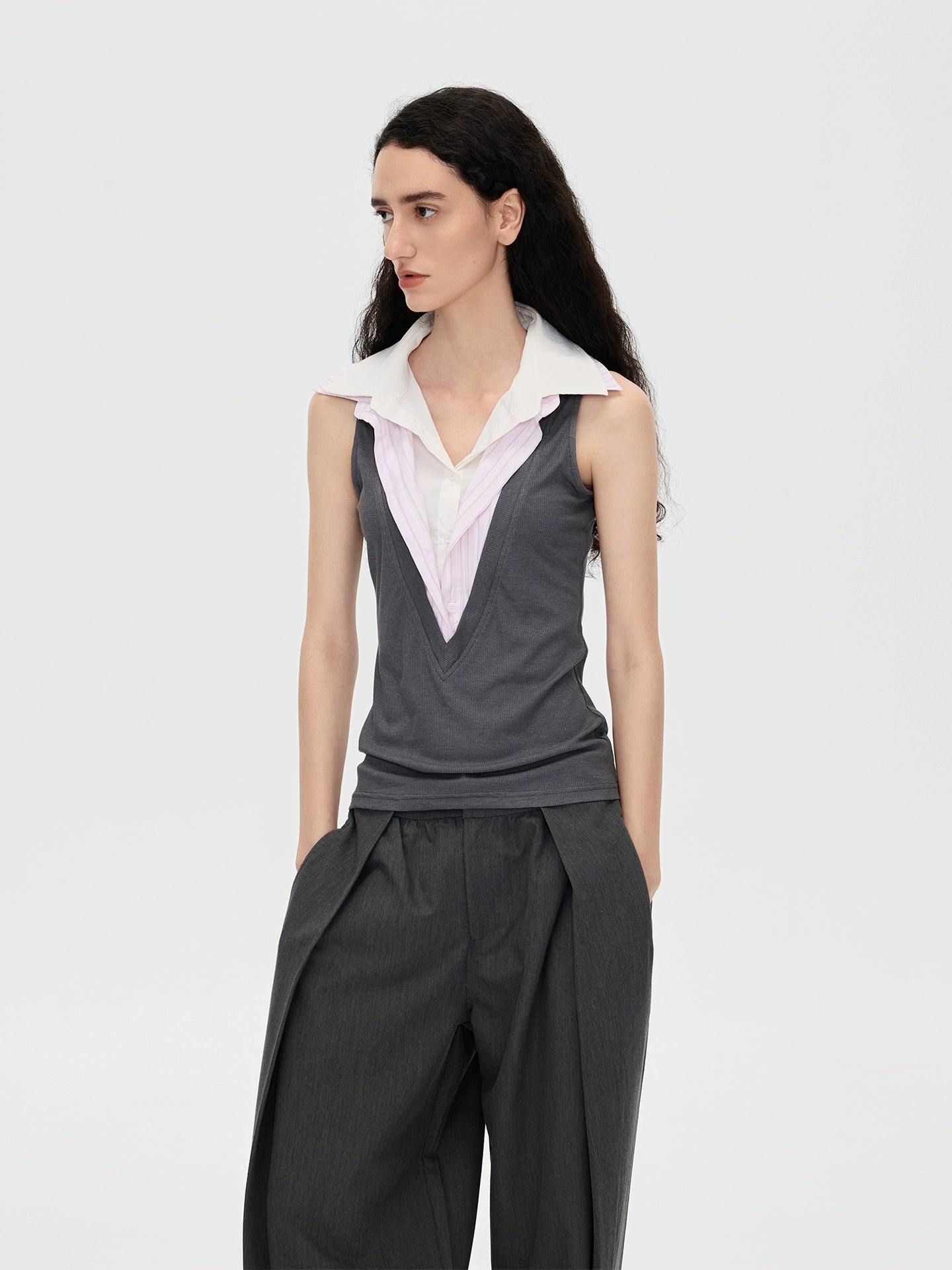 This stylish pink striped knit tank top from Sanhoostudio features a unique double-layer neckline with acetate fabric, offering a slim fit and modern streetwear vibe. Perfect for layering or standalone wear in both casual and chic outfits.