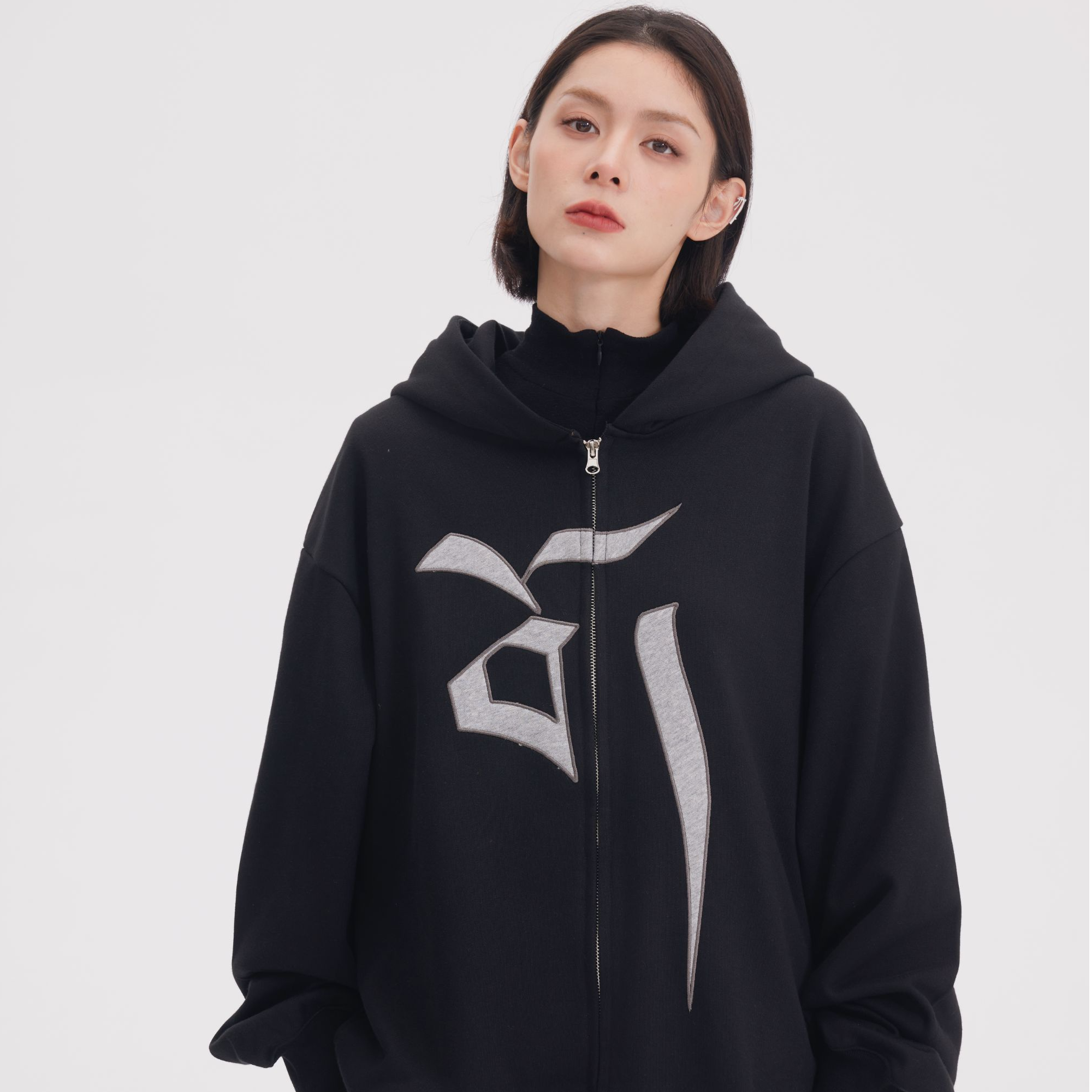 Sanhoostudio hooded sweatshirt featuring Vajra-inspired design and relaxed oversized fit for unisex streetwear.
