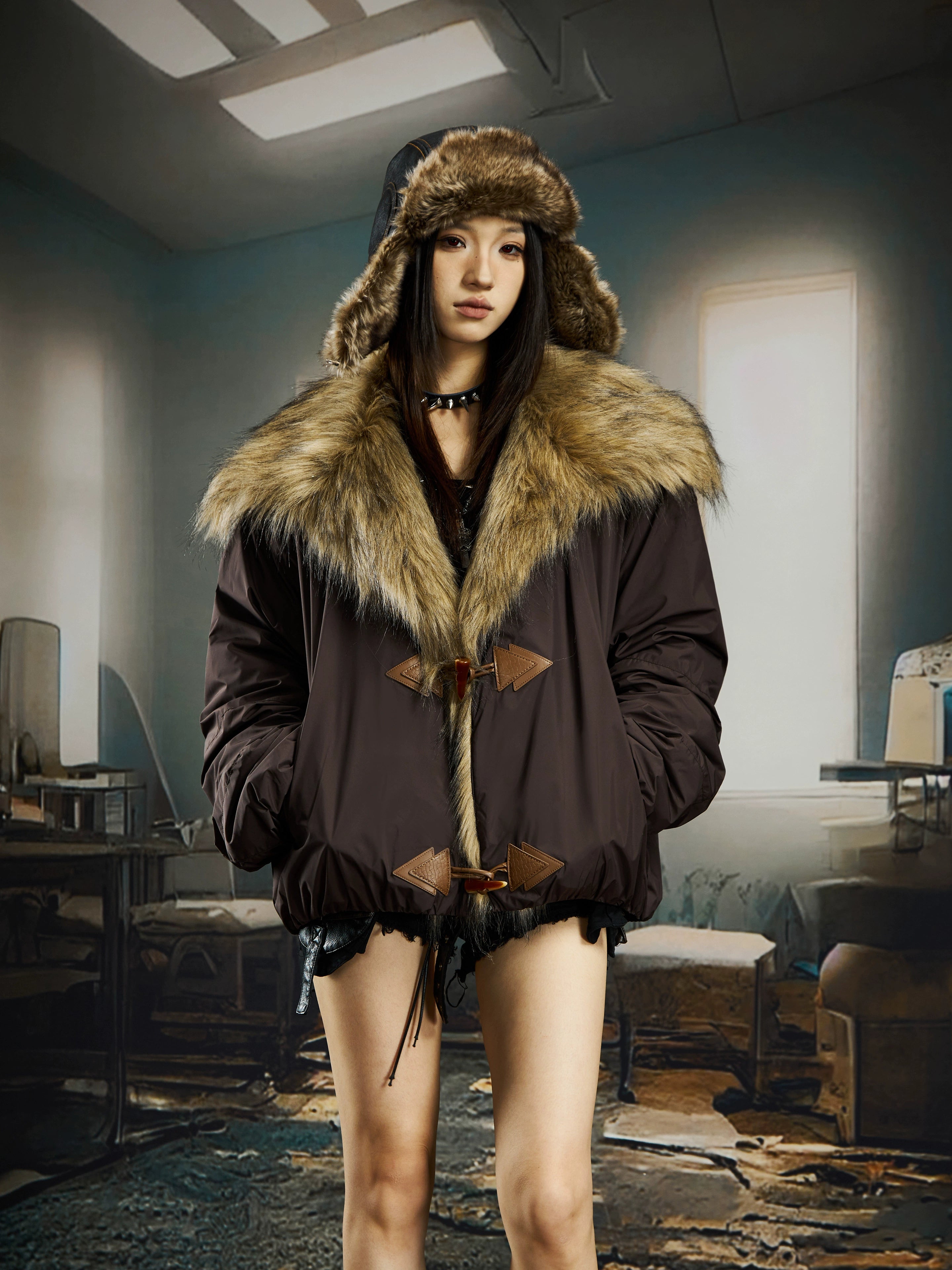 A luxurious wide-lapel cropped puffer with soft fur trim and thick padding. Designed by Sanhoostudio for high-street winter styling with a bold silhouette.