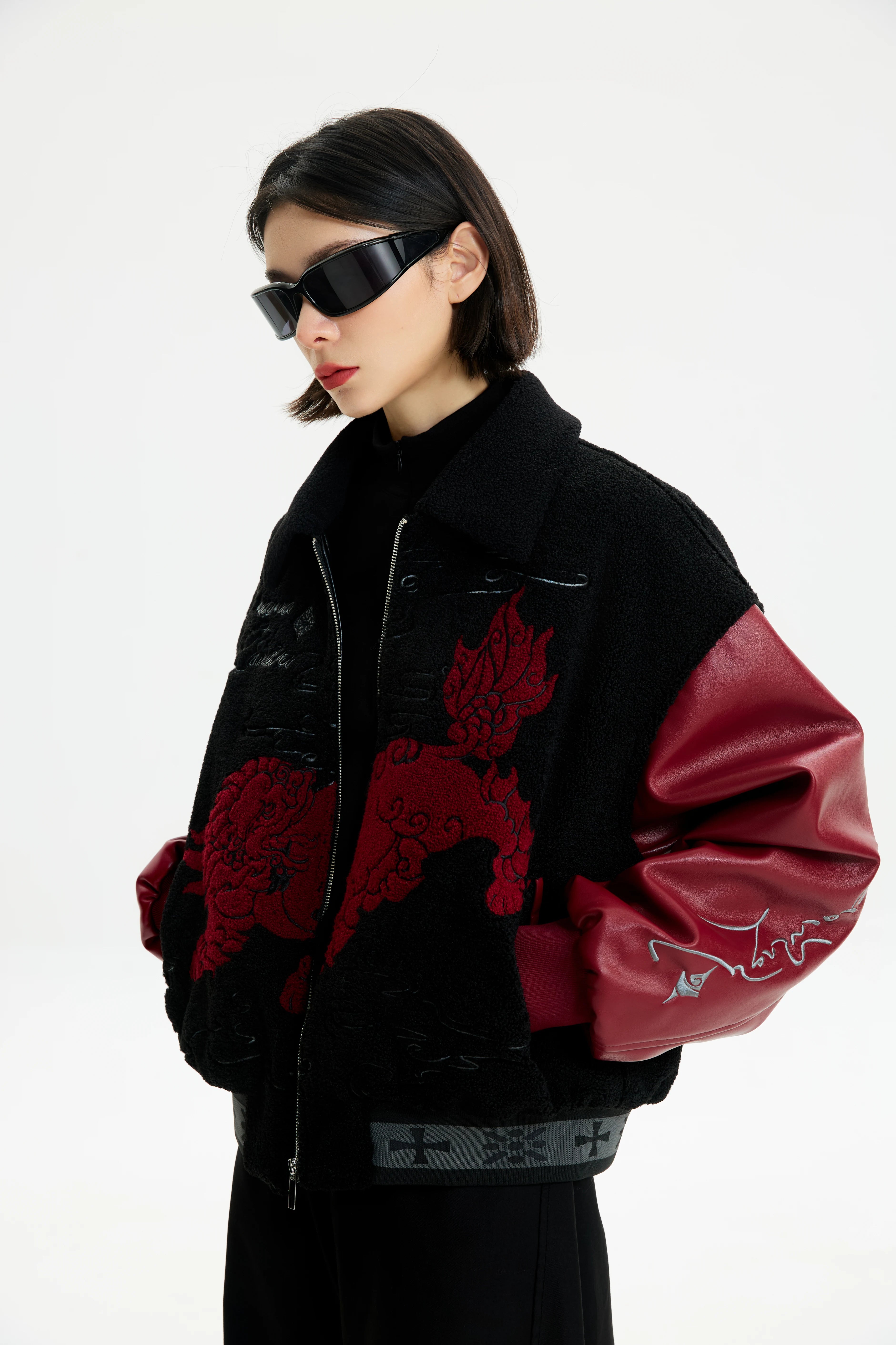 Sanhoostudio zip-up leather jacket with sherpa lining for warmth. Designed for unisex winter streetwear and comfort.