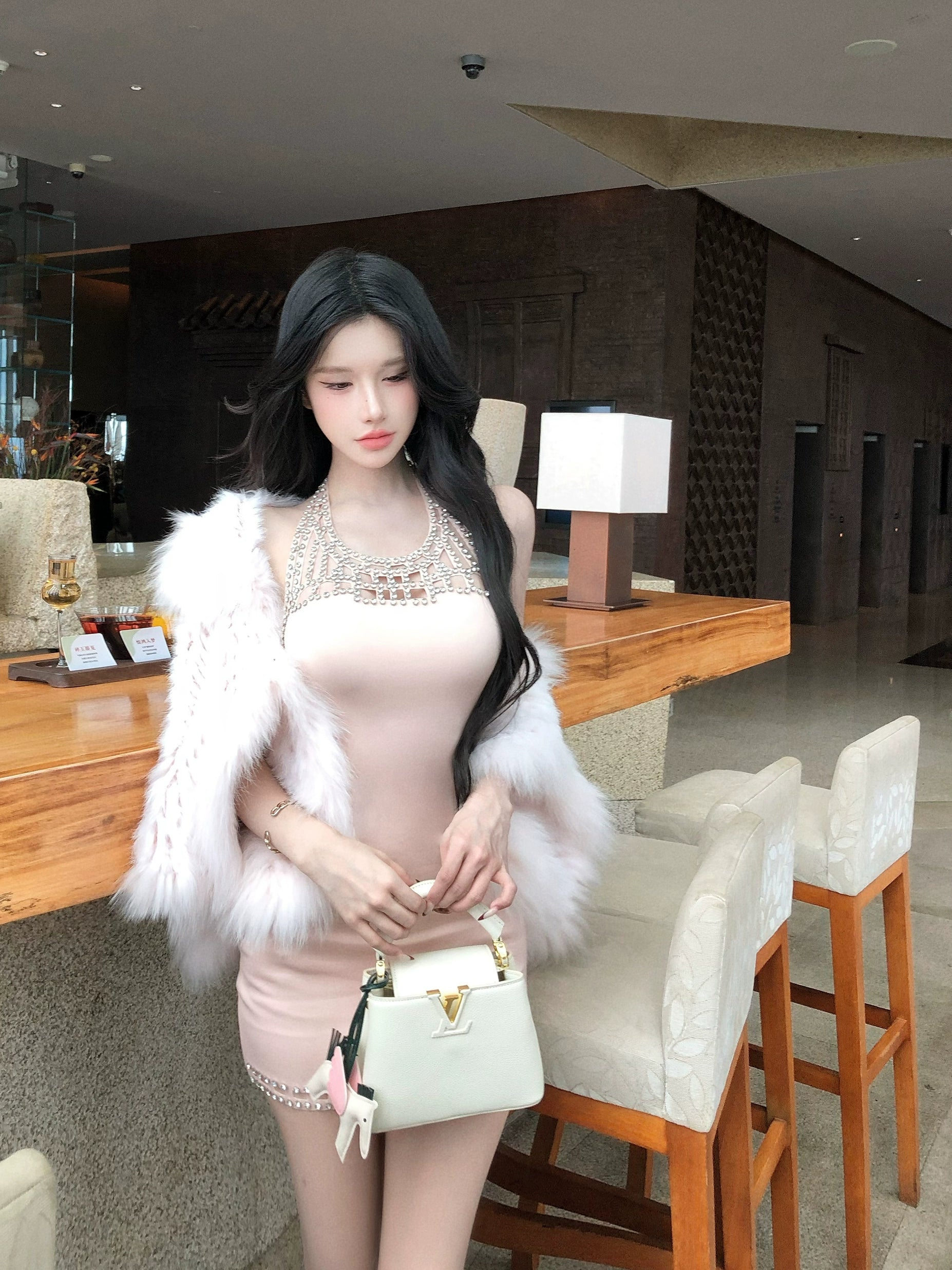 Explore the Sexy Hollow Halter Bodycon Dress at Sanhoostudio, a French-inspired cut-out design for a bold and stylish autumn look.