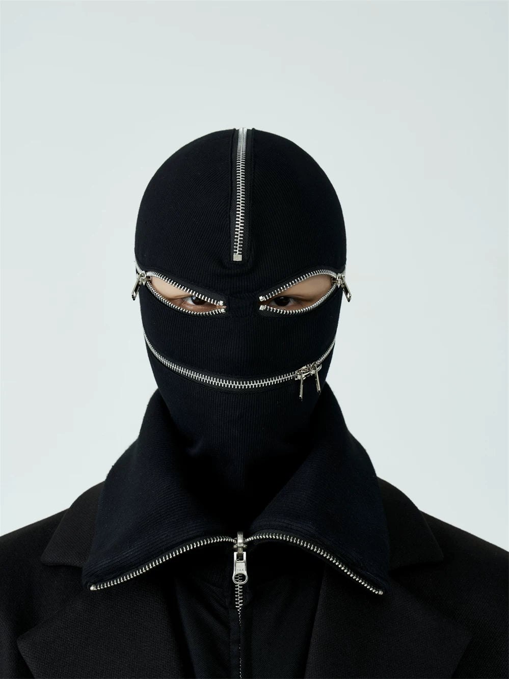 Sanhoostudio black and white zip-up hood mask designed for unisex streetwear styling. Featuring a full zip closure, foldable structure, and warm layered design for casual spring wear.