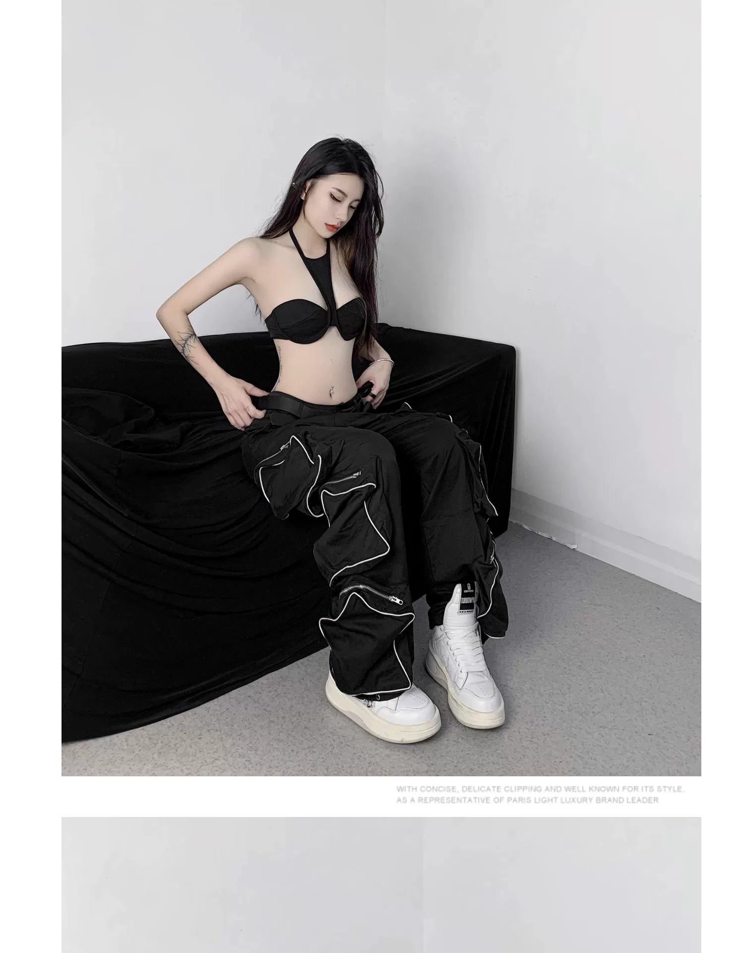 These reflective cargo pants from Sanhoostudio feature 3D star patches and bold avant-garde styling. The oversized fit and dark aesthetic make them ideal for nightwear, performance looks, or urban outfits, blending futuristic energy with functional streetwear practicality.