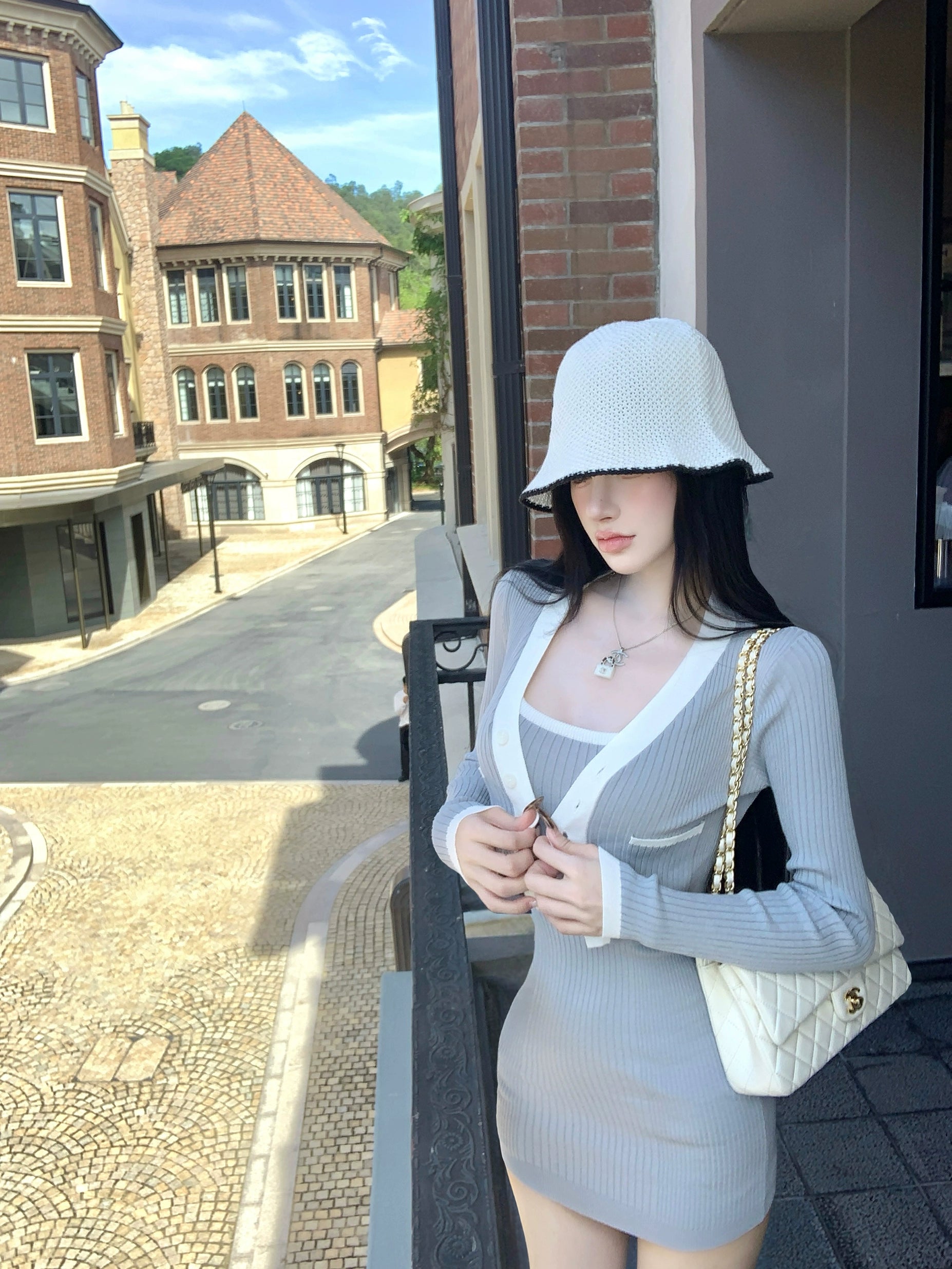 Sanhoostudio presents the Knit Cardigan Dress Set, a fashionable two-piece combining comfort and elegance for effortless autumn wear.