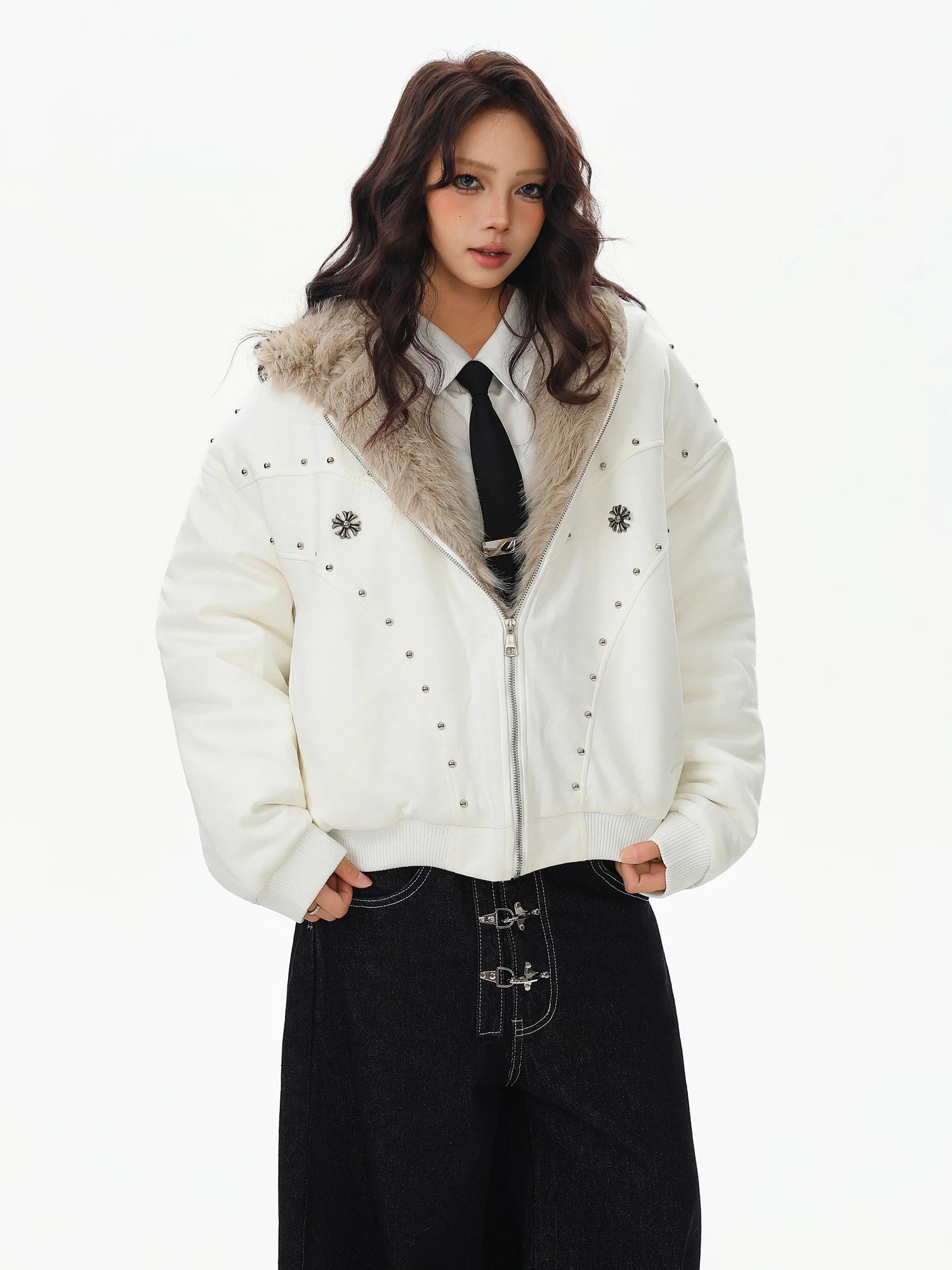 Sanhoostudio padded jacket with fur collar and hooded design, featuring mountain eagle detailing and stud accents. Built for warmth with a structured streetwear silhouette for winter styling.