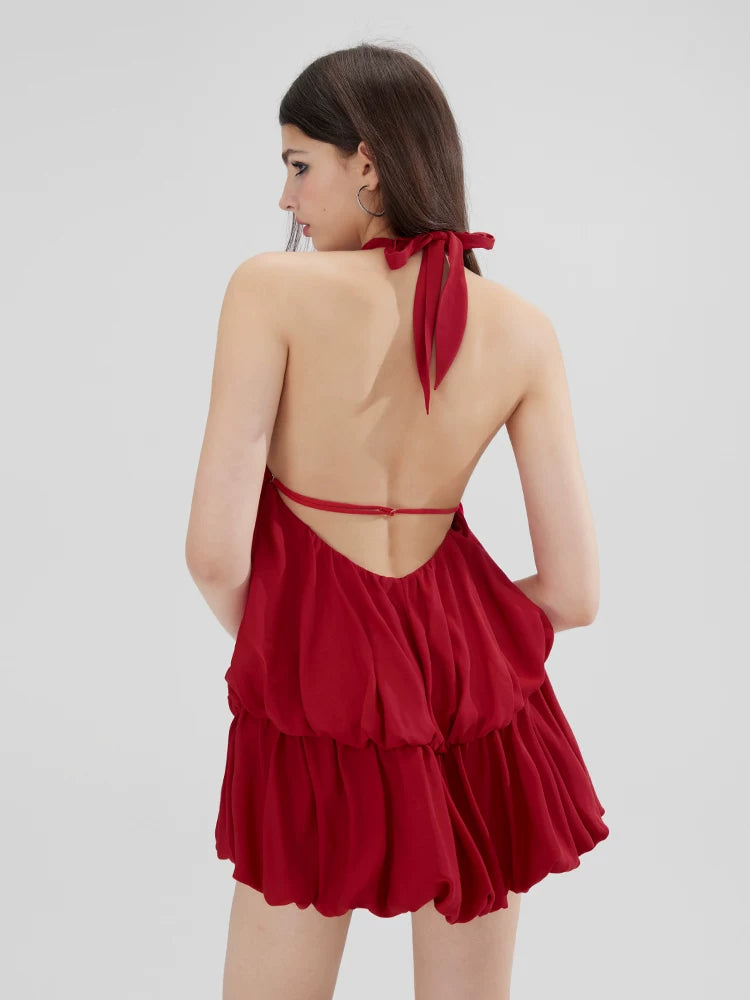 Sanhoostudio red halter dress featuring a bubble silhouette and feminine design. A summer-ready piece blending sweetness and confident style.