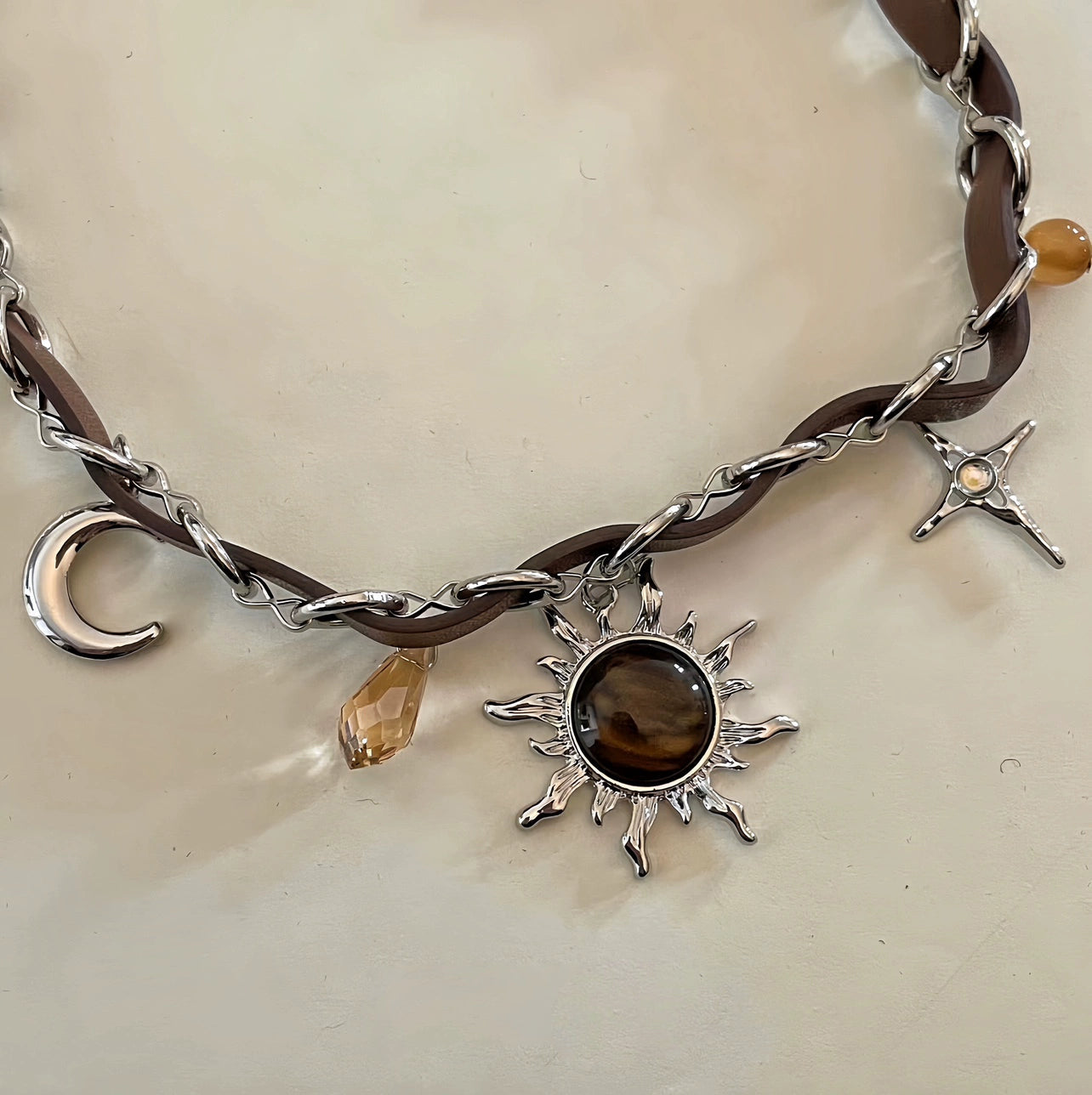 Sanhoostudio’s Mallard brown sunburst choker necklace showcases a bold sun-inspired design with warm brown tones, perfect for fashion-forward individuals seeking a standout, retro-luxe accessory.