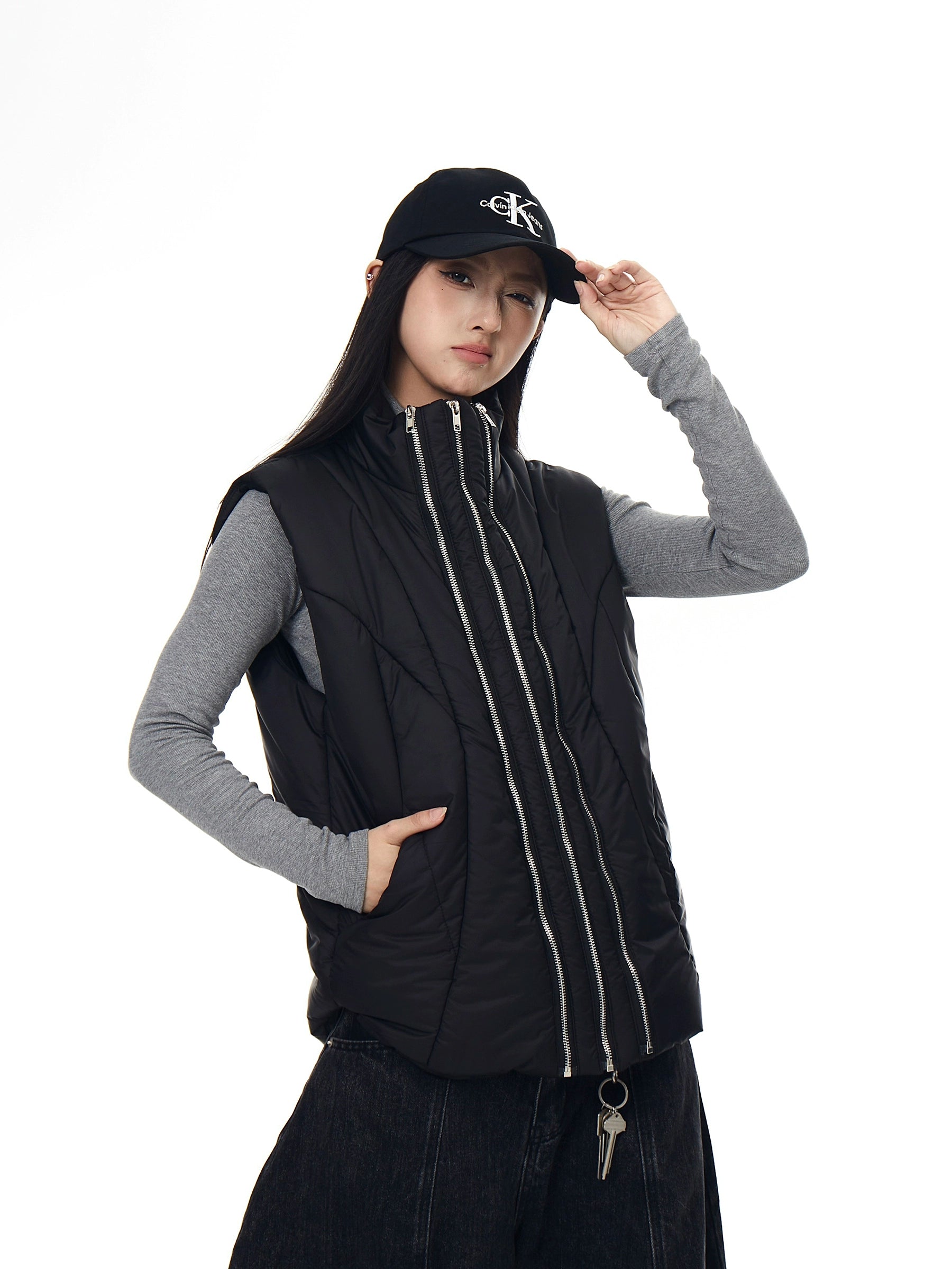 A functional tech-style puffer vest with deconstructed paneling and a bold zip-up design. Unisex, versatile, and perfect for layering in winter. High-street utility wear from Sanhoostudio.