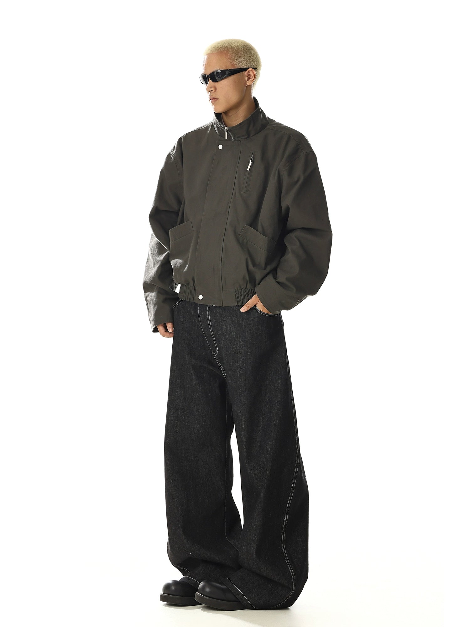 Crafted for versatility, this retro-inspired flight jacket features a stand collar and utility pocket design. Its cleanfit tailoring and oversized comfort make it a staple for streetwear enthusiasts. Shop unique outerwear at Sanhoostudio.