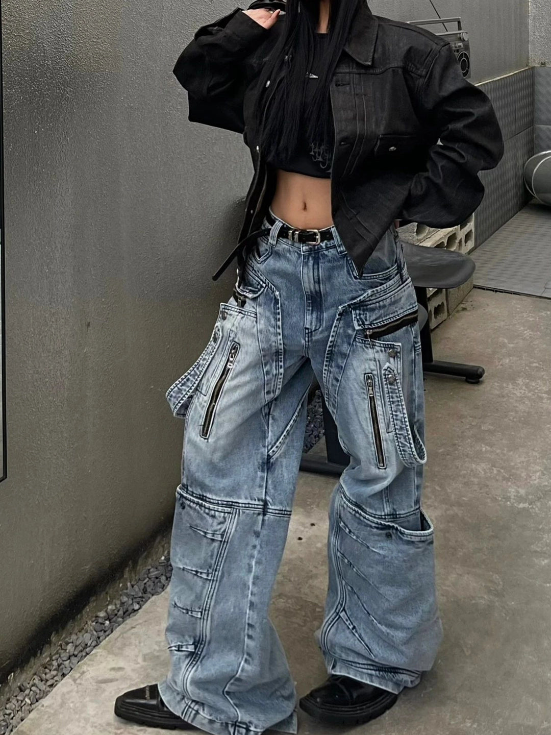 These heavy-duty cargo pants from Sanhoostudio combine deconstructed patchwork with multi-pocket functionality, delivering rugged streetwear style in a wide-leg floor-length cut. A bold fashion-forward piece.
