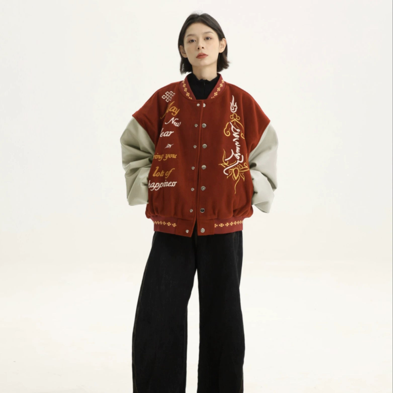 Sanhoostudio varsity jacket with patchwork construction and embroidery. A unisex retro-inspired streetwear outerwear piece.