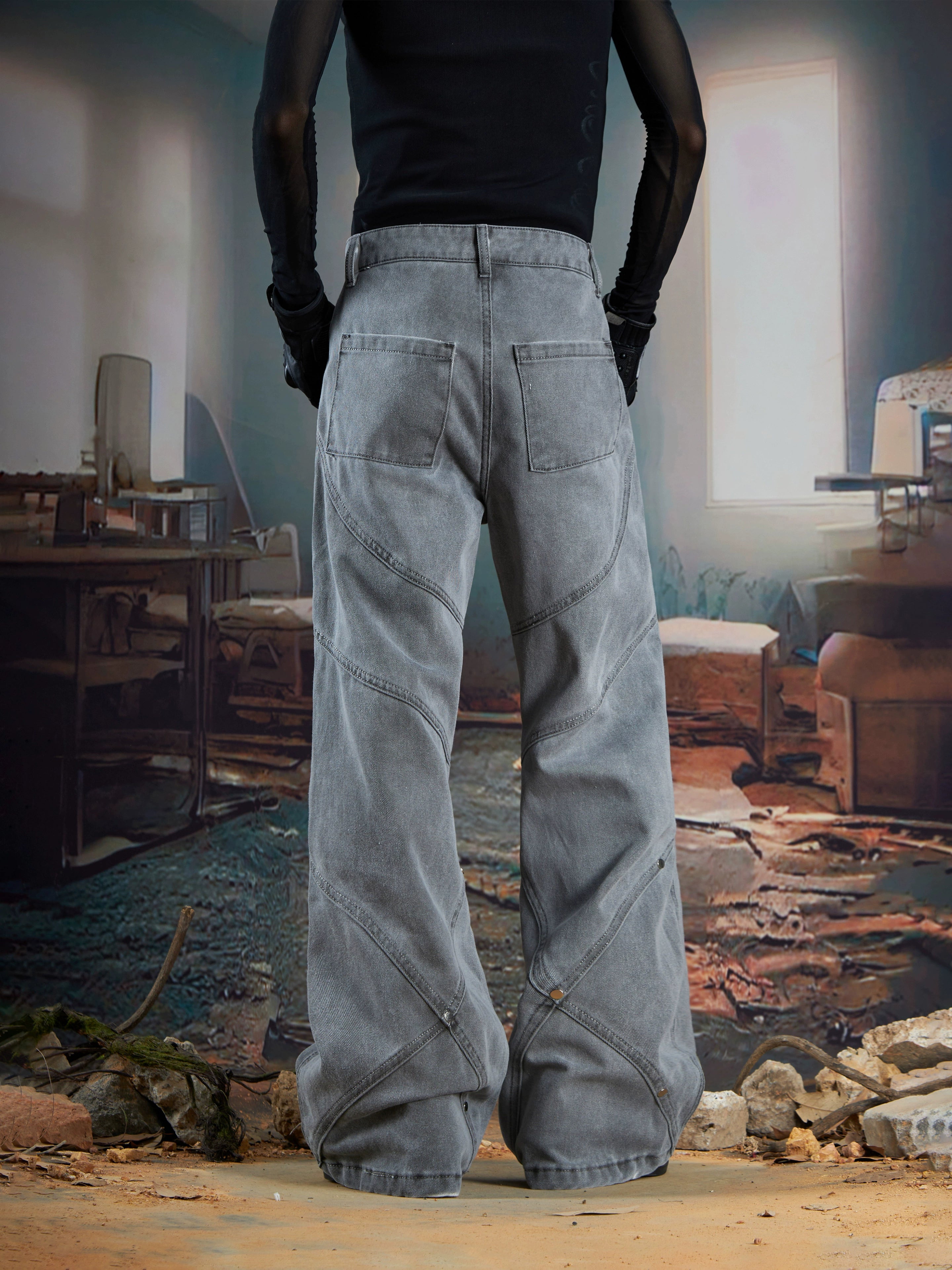 Rock an edgy look with these dark studded denim jeans, designed with structured panels and a slim-fit washed finish. Their subtle flare adds a touch of retro to punk-inspired outfits. Shop them at Sanhoostudio.