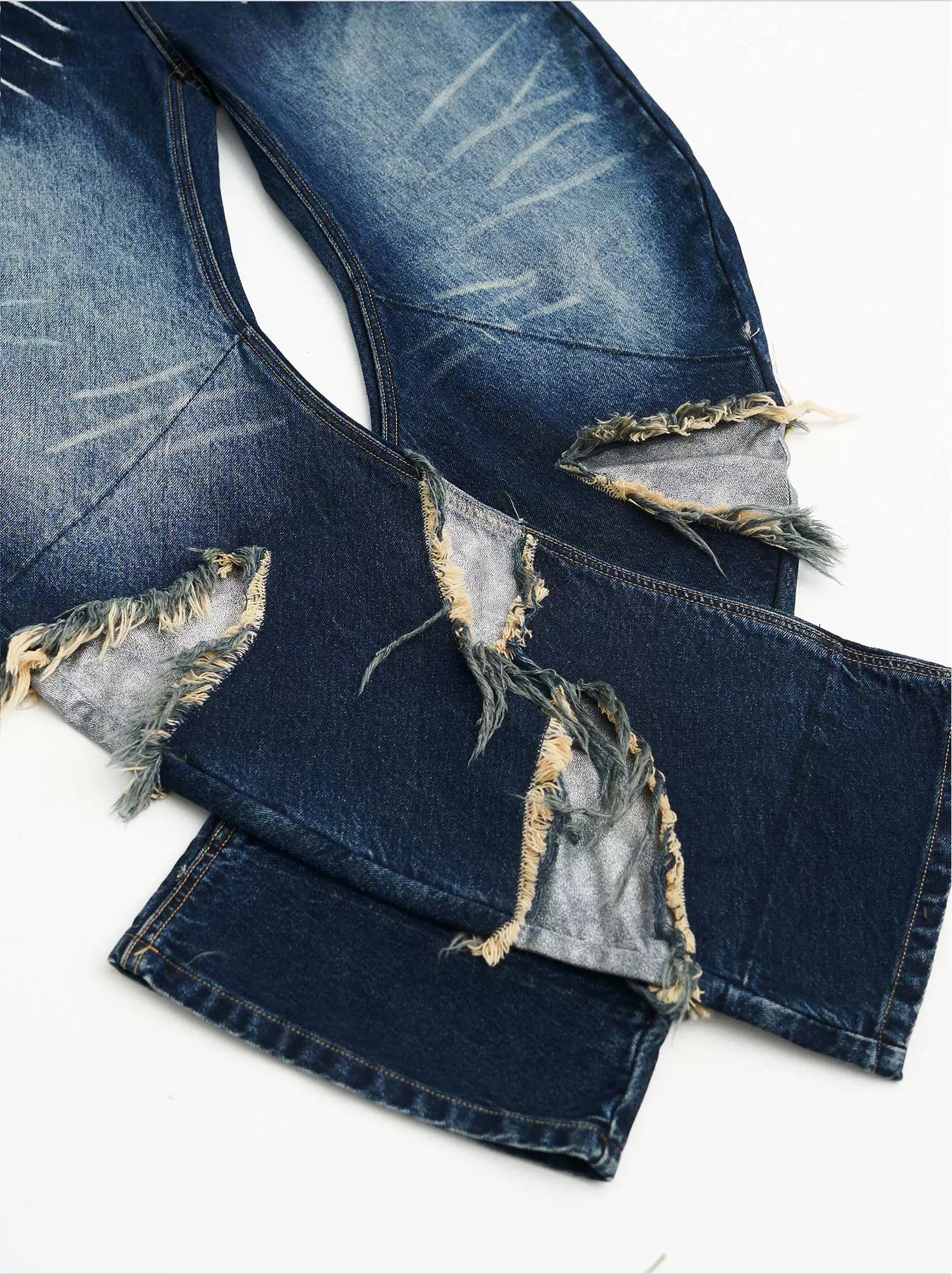 Sanhoostudio’s distressed claw-scratch denim scimitar pants feature washed patchwork craftsmanship, a loose fit, and slight stretch for comfort. Designed in blue-black denim, they bring an edgy streetwear vibe to any casual or punk-inspired outfit.