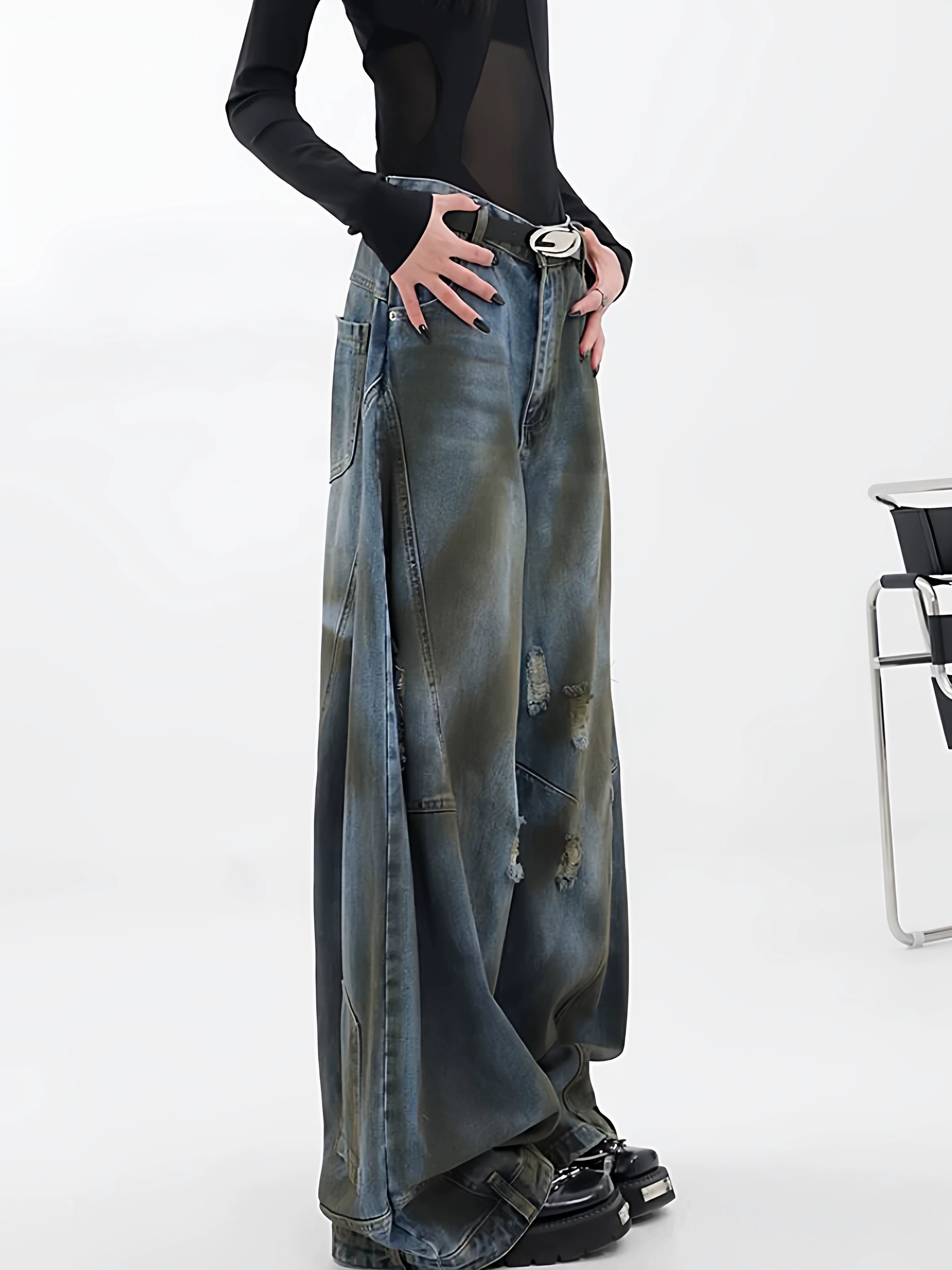 Sanhoostudio wide leg jeans featuring reverse panel construction and distressed details. A high street denim piece with bold design character.