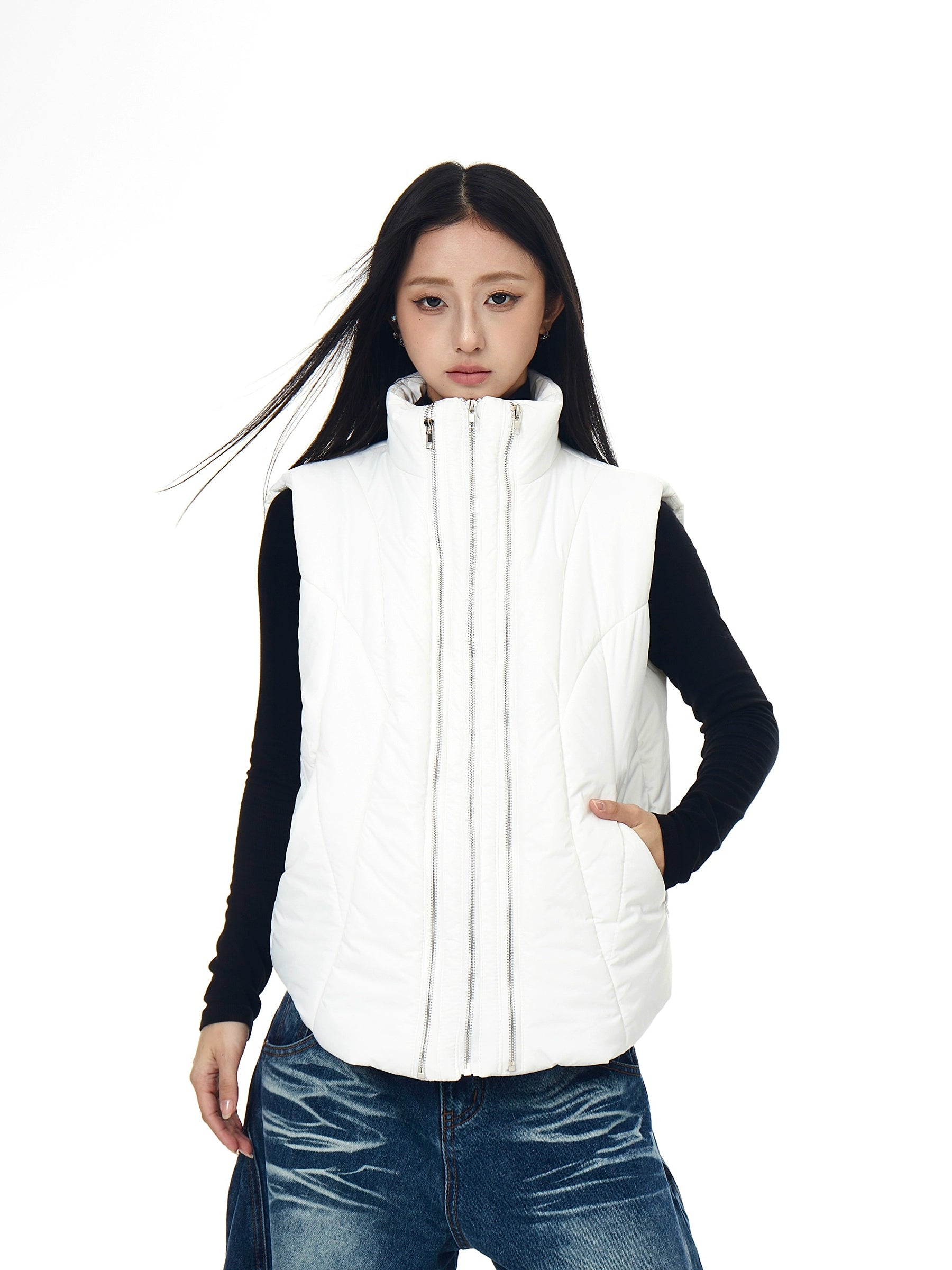 A functional tech-style puffer vest with deconstructed paneling and a bold zip-up design. Unisex, versatile, and perfect for layering in winter. High-street utility wear from Sanhoostudio.