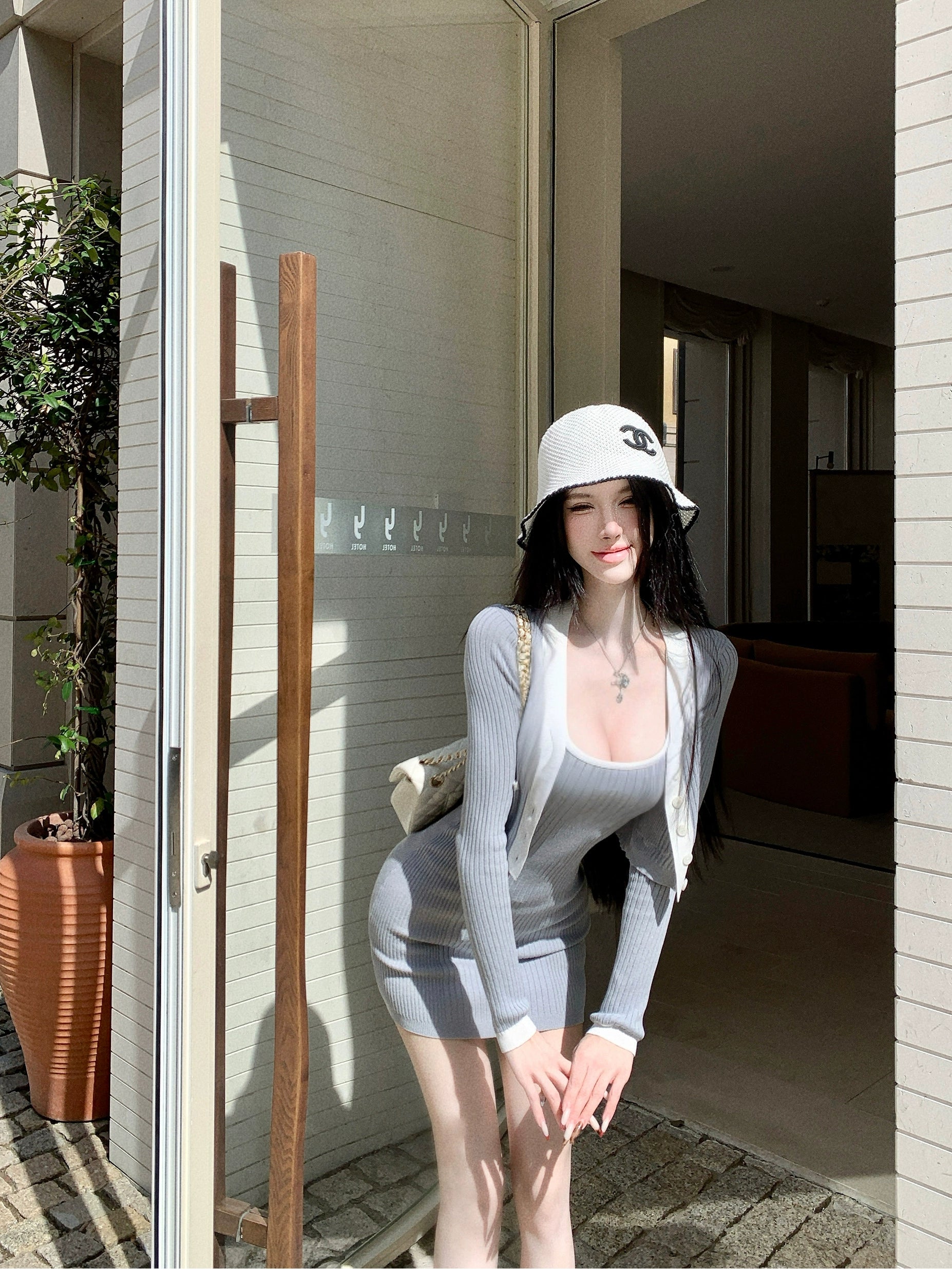 Sanhoostudio presents the Knit Cardigan Dress Set, a fashionable two-piece combining comfort and elegance for effortless autumn wear.
