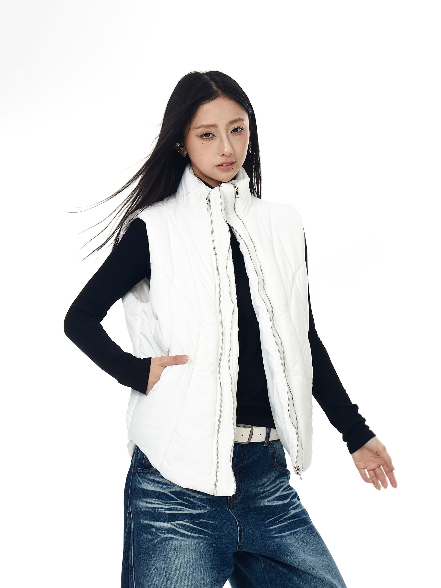 A functional tech-style puffer vest with deconstructed paneling and a bold zip-up design. Unisex, versatile, and perfect for layering in winter. High-street utility wear from Sanhoostudio.