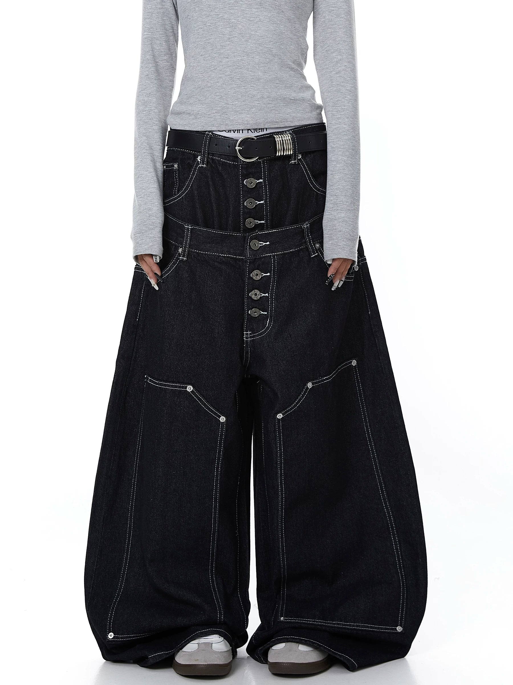 Sanhoostudio denim pants featuring double waistband design, exposed stitching, and button details. Built with a wide leg silhouette for high street styling.