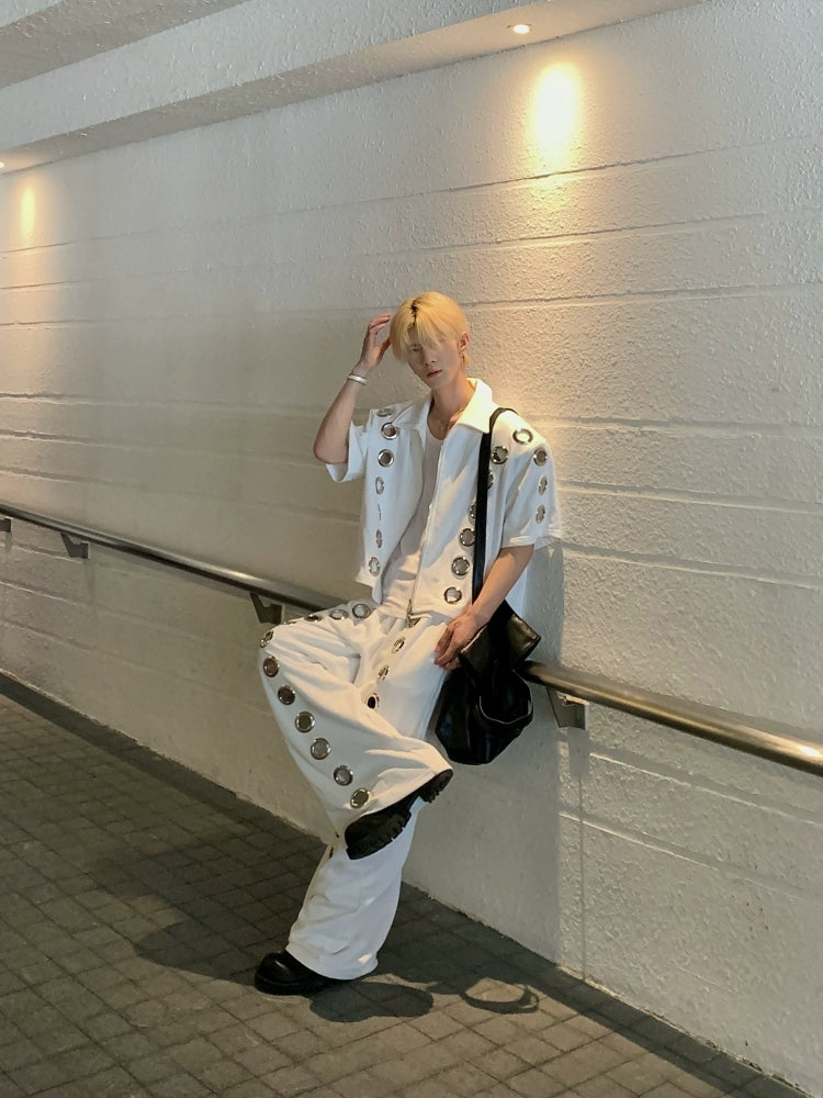 The Sanhoostudio two-piece set combines a cropped hoodie with metal ring hollow details and a matching bottom for a coordinated high street look. With its relaxed fit and edgy design, this set delivers both comfort and standout individuality for streetwear enthusiasts.