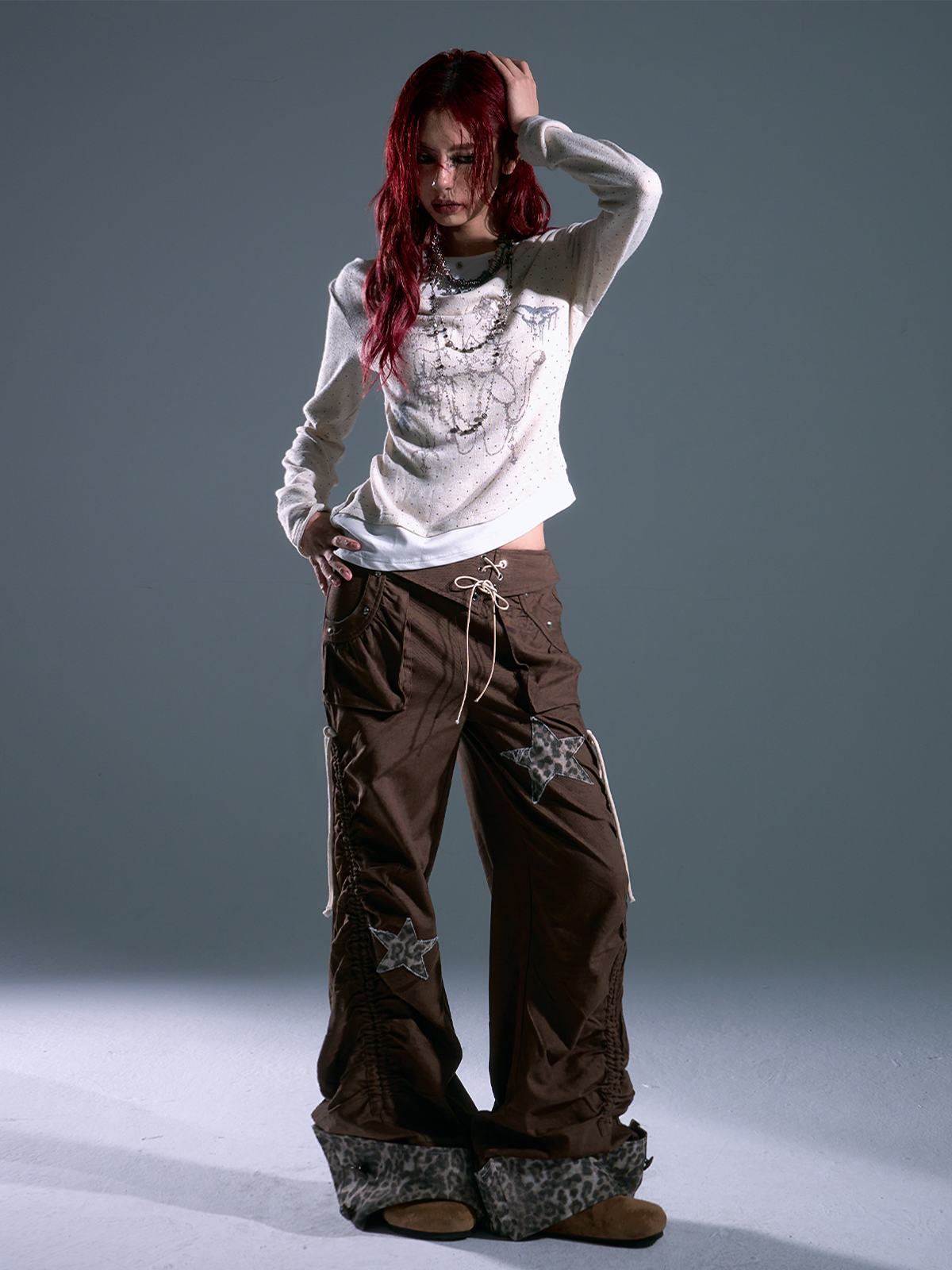 Shop Sanhoostudio’s retro-inspired polka dot knit top with a layered effect and slim fit. A perfect mix of vintage elegance and modern streetwear for versatile styling.