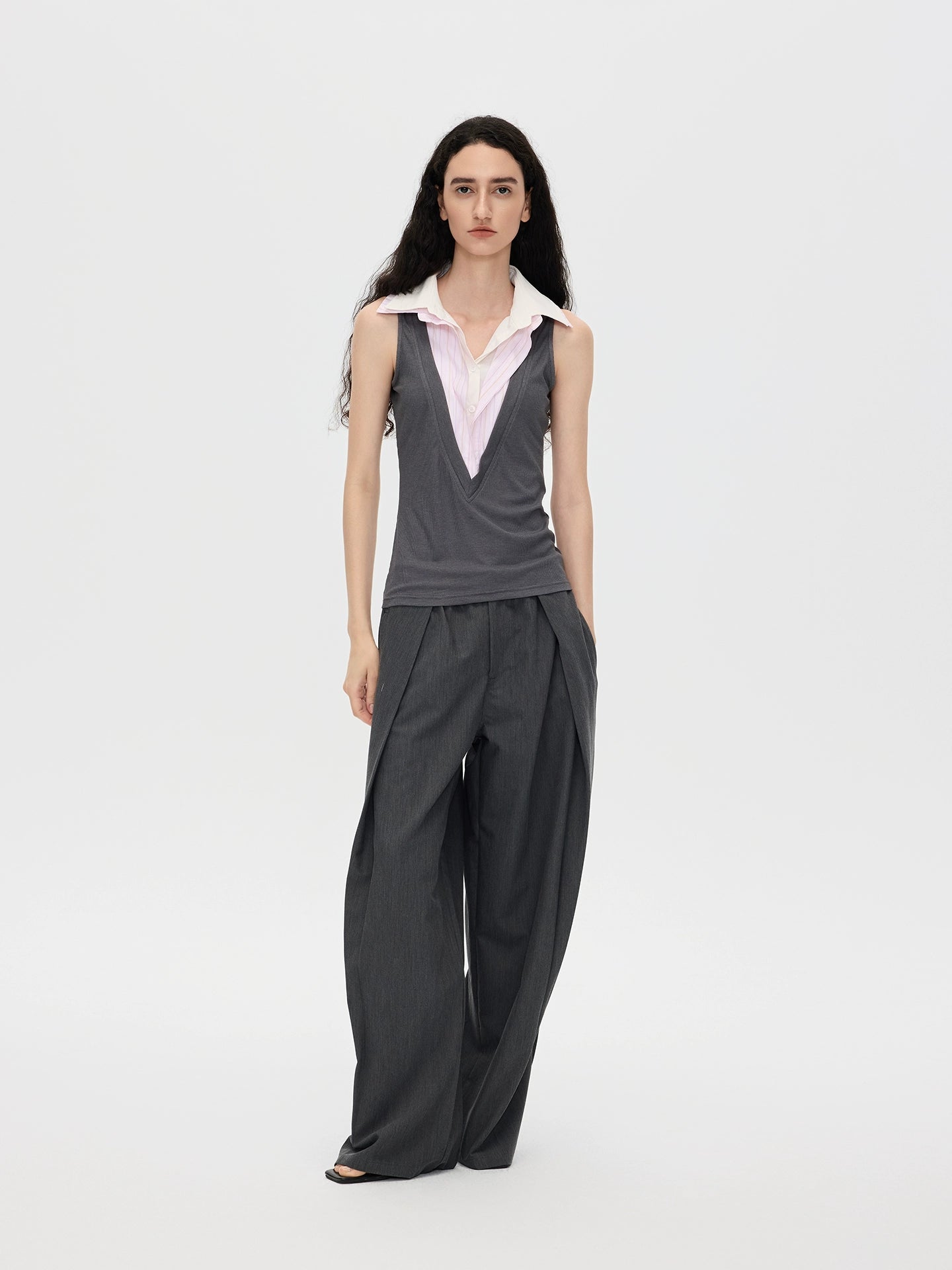 This stylish pink striped knit tank top from Sanhoostudio features a unique double-layer neckline with acetate fabric, offering a slim fit and modern streetwear vibe. Perfect for layering or standalone wear in both casual and chic outfits.