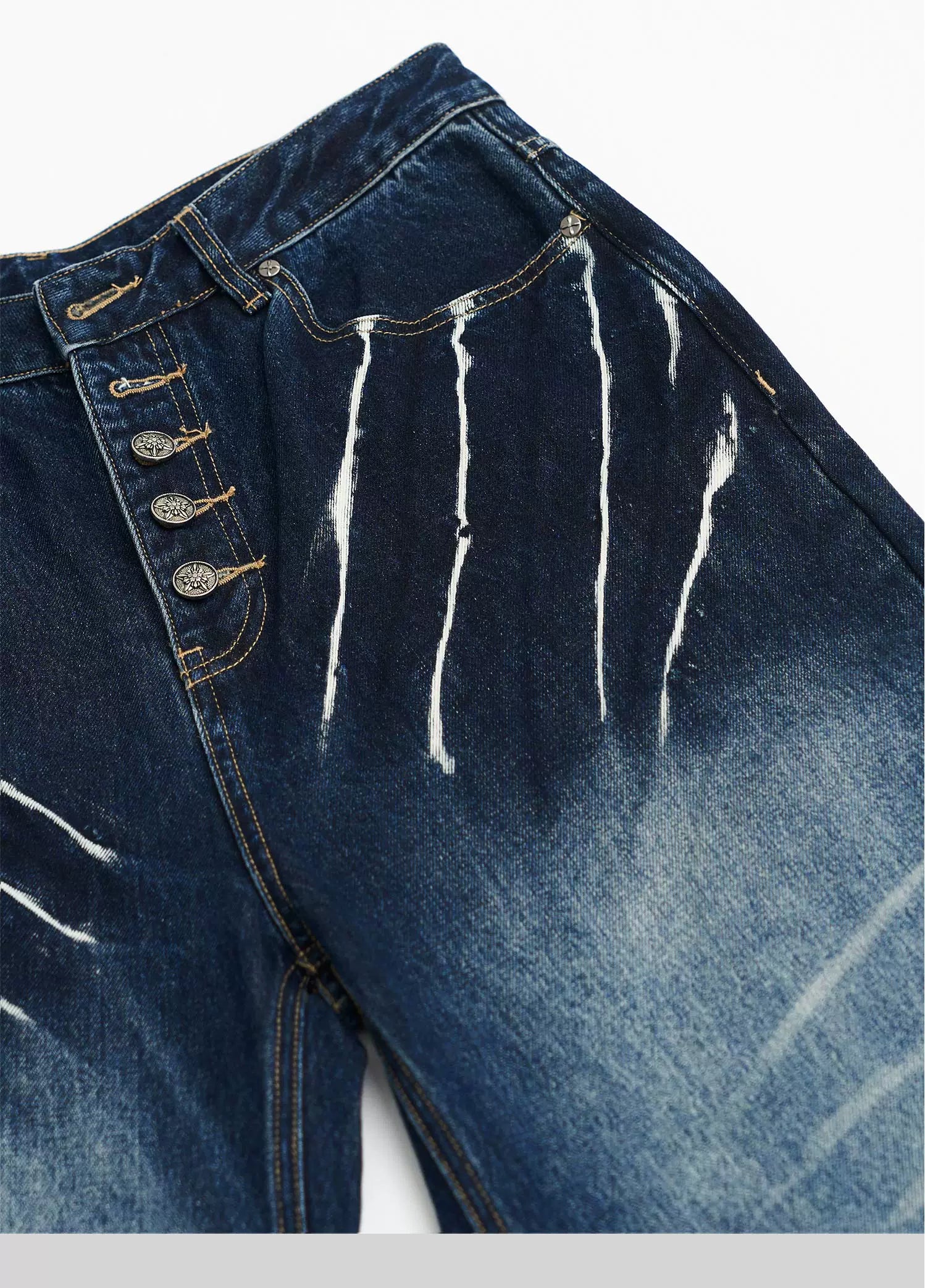 Sanhoostudio’s distressed claw-scratch denim scimitar pants feature washed patchwork craftsmanship, a loose fit, and slight stretch for comfort. Designed in blue-black denim, they bring an edgy streetwear vibe to any casual or punk-inspired outfit.