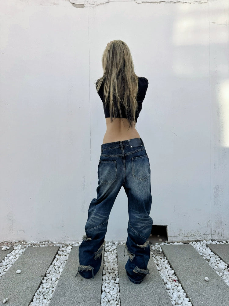 Sanhoostudio’s distressed claw-scratch denim scimitar pants feature washed patchwork craftsmanship, a loose fit, and slight stretch for comfort. Designed in blue-black denim, they bring an edgy streetwear vibe to any casual or punk-inspired outfit.