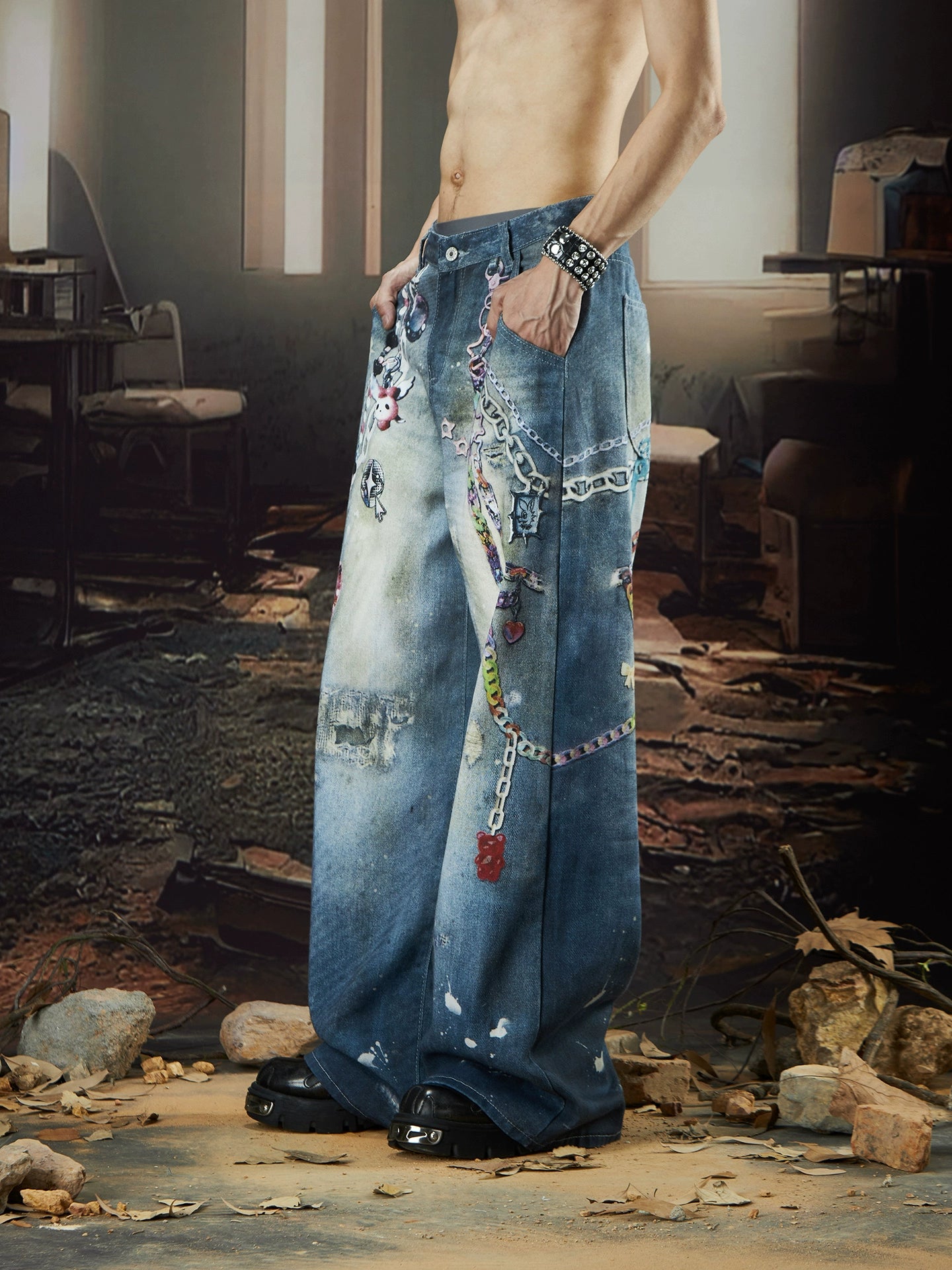 The Sanhoostudio jeans combine digital multicolor chain prints with a washed distressed finish in a straight-leg silhouette. Their oversized cut and bold pattern make them an expressive statement piece for modern streetwear outfits.