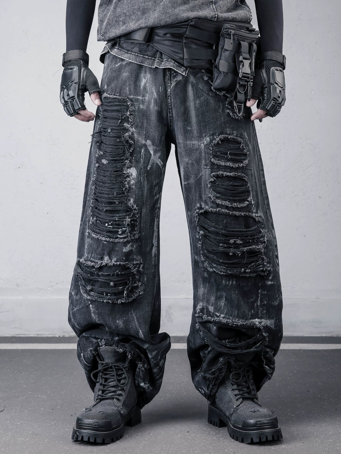 Sanhoostudio wide leg denim pants featuring distressed wash, painted effect, and ripped detailing. Designed with a scythe-cut silhouette for bold streetwear outfits, combining comfort, texture, and everyday versatility.