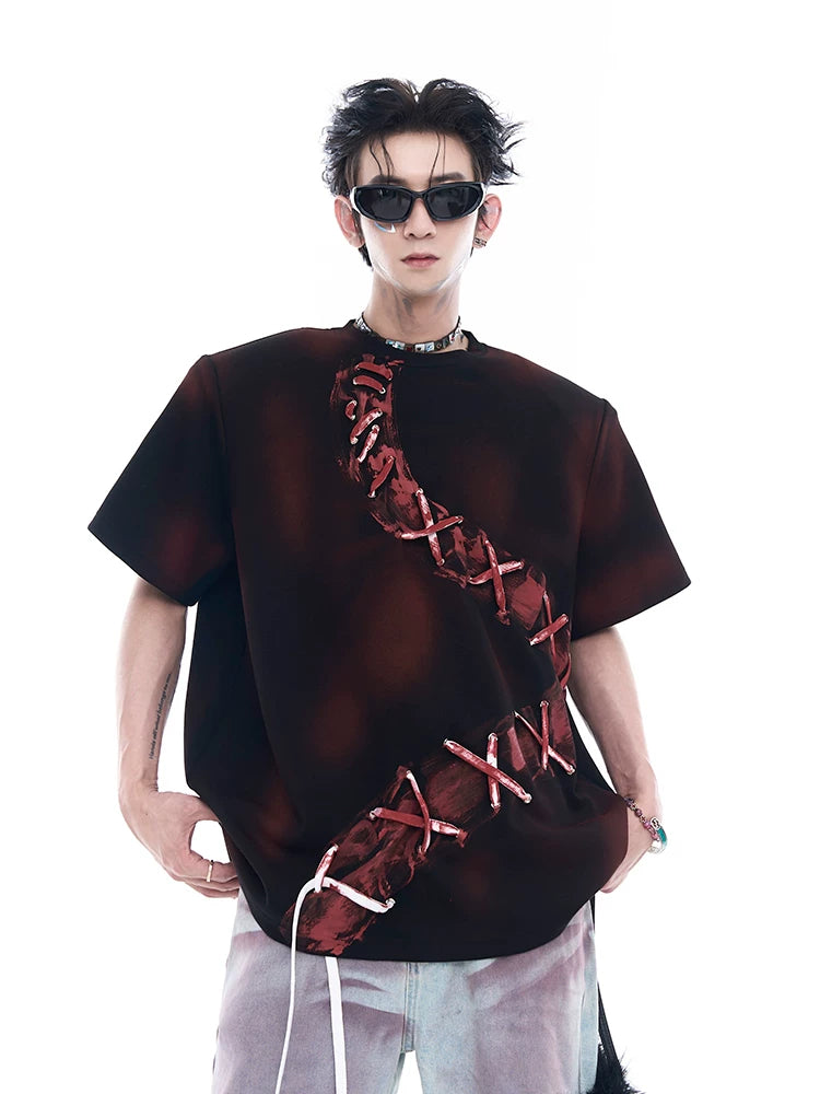 Sanhoostudio dark red T-shirt featuring spray dye effect and lace-up design. A unique streetwear piece combining bold color and artistic detailing.
