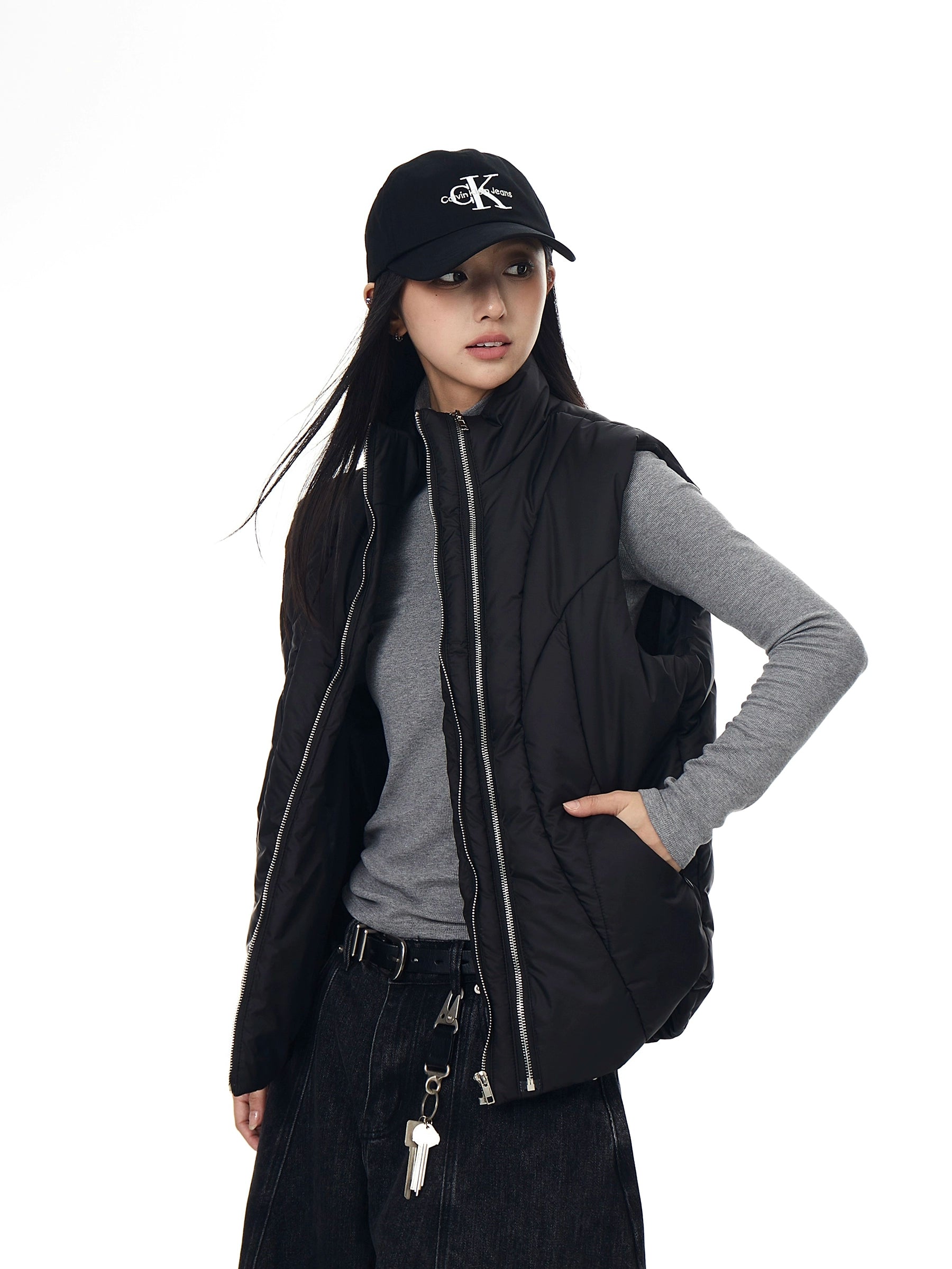 A functional tech-style puffer vest with deconstructed paneling and a bold zip-up design. Unisex, versatile, and perfect for layering in winter. High-street utility wear from Sanhoostudio.