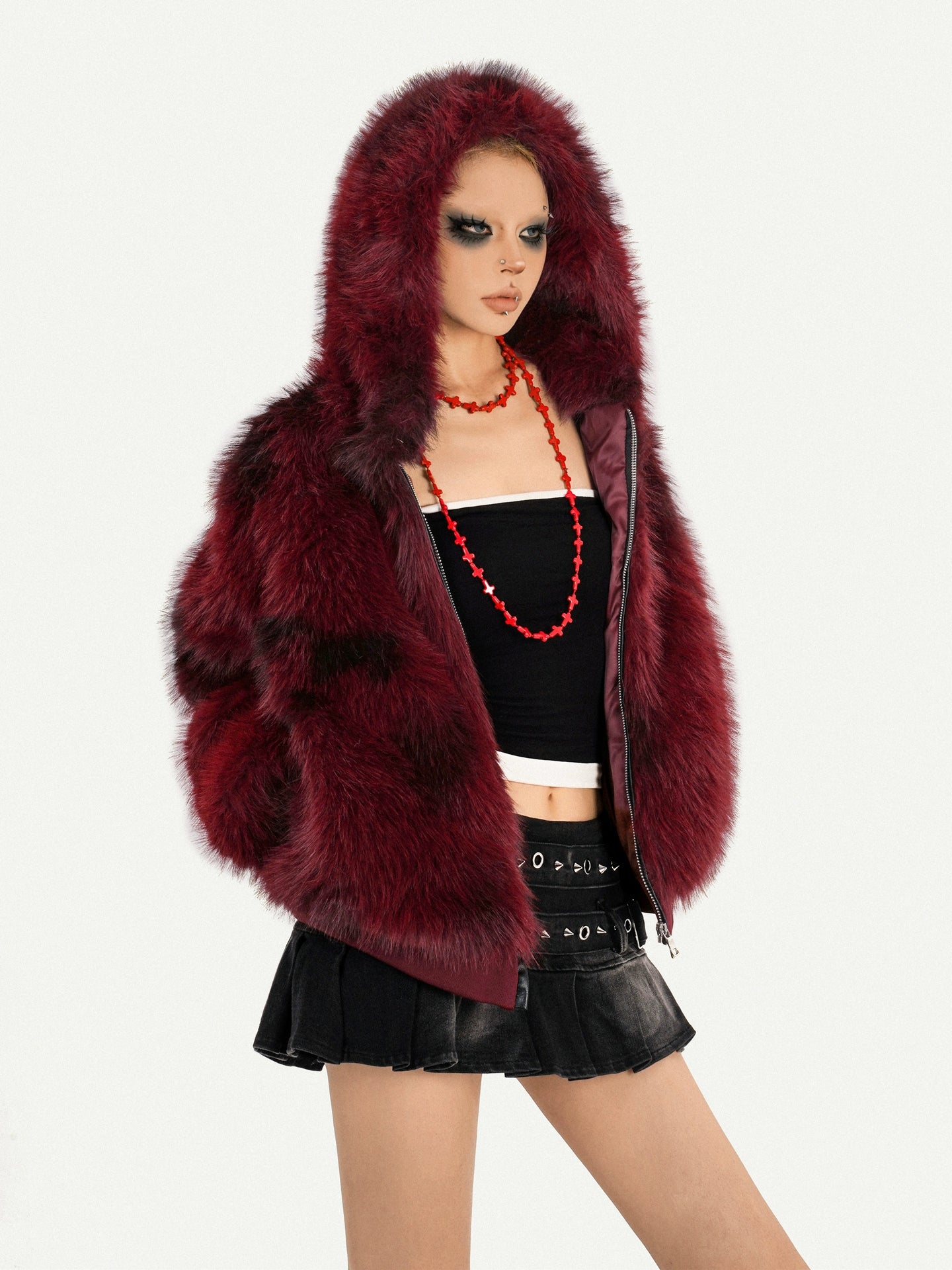 Sanhoostudio’s red furry jacket combines warmth and attitude in a striking hooded silhouette—an essential piece for bold winter street styling.