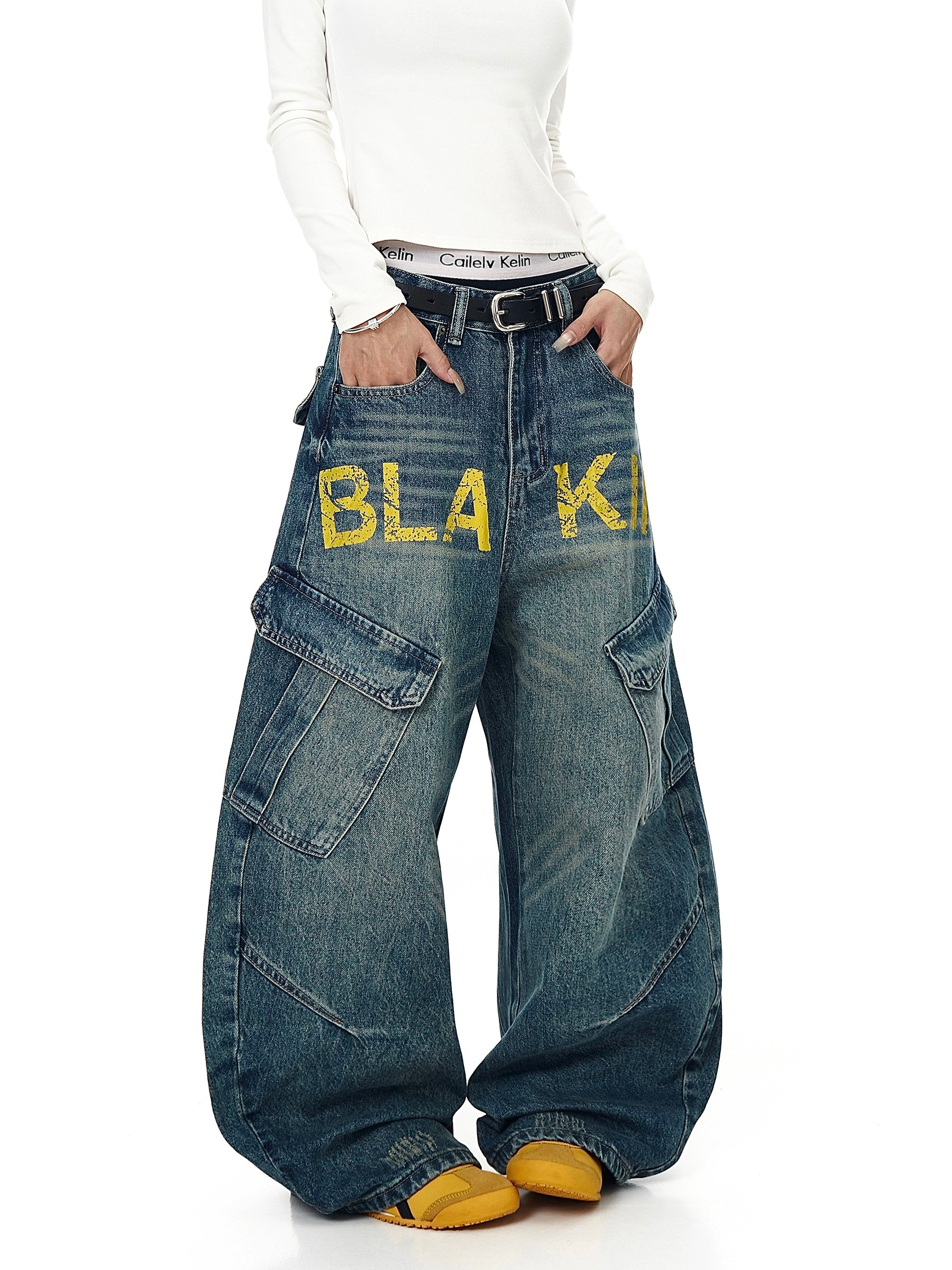 Deconstruction meets functionality in these multi-pocket denim pants. Featuring a unique cut and bold lettering, they channel SanhooStudio’s signature street-lab creativity.