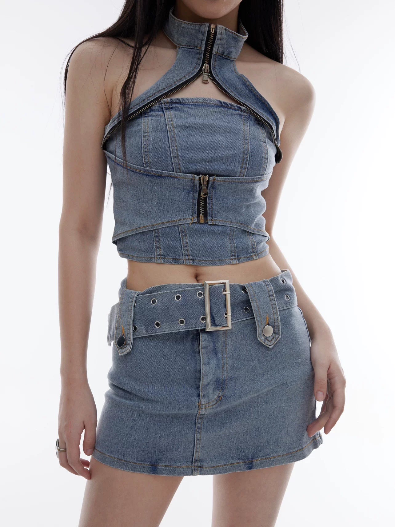 Sanhoostudio denim two-piece set featuring a halter crop top and body-hugging skirt. Designed for a bold and slimming streetwear look.