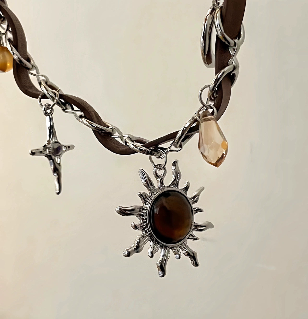 Sanhoostudio’s Mallard brown sunburst choker necklace showcases a bold sun-inspired design with warm brown tones, perfect for fashion-forward individuals seeking a standout, retro-luxe accessory.