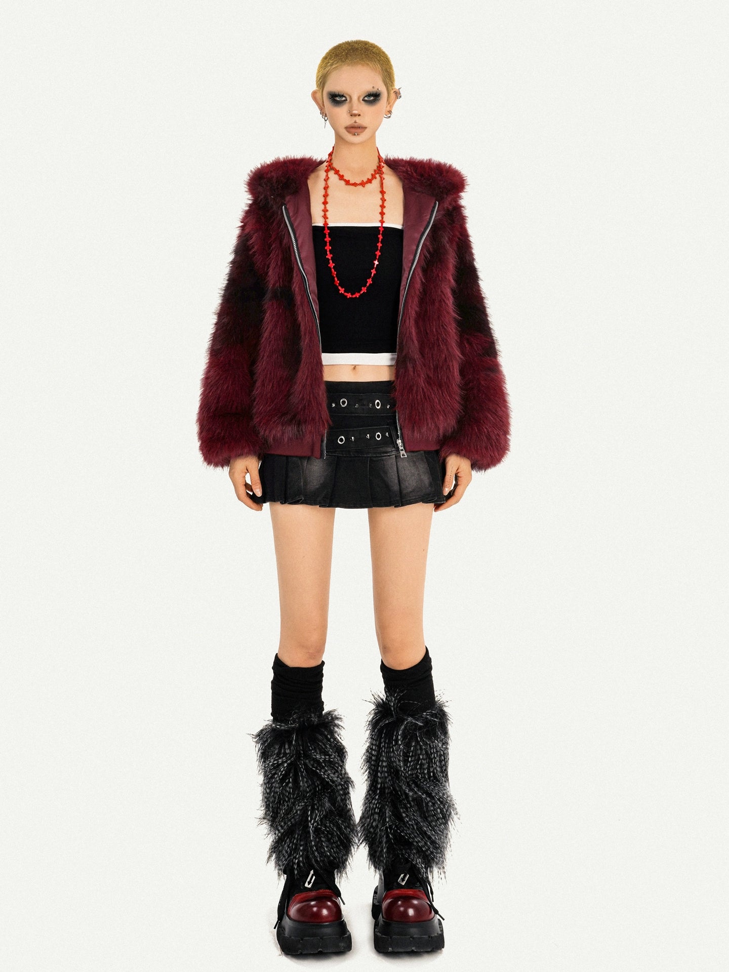 Sanhoostudio’s red furry jacket combines warmth and attitude in a striking hooded silhouette—an essential piece for bold winter street styling.