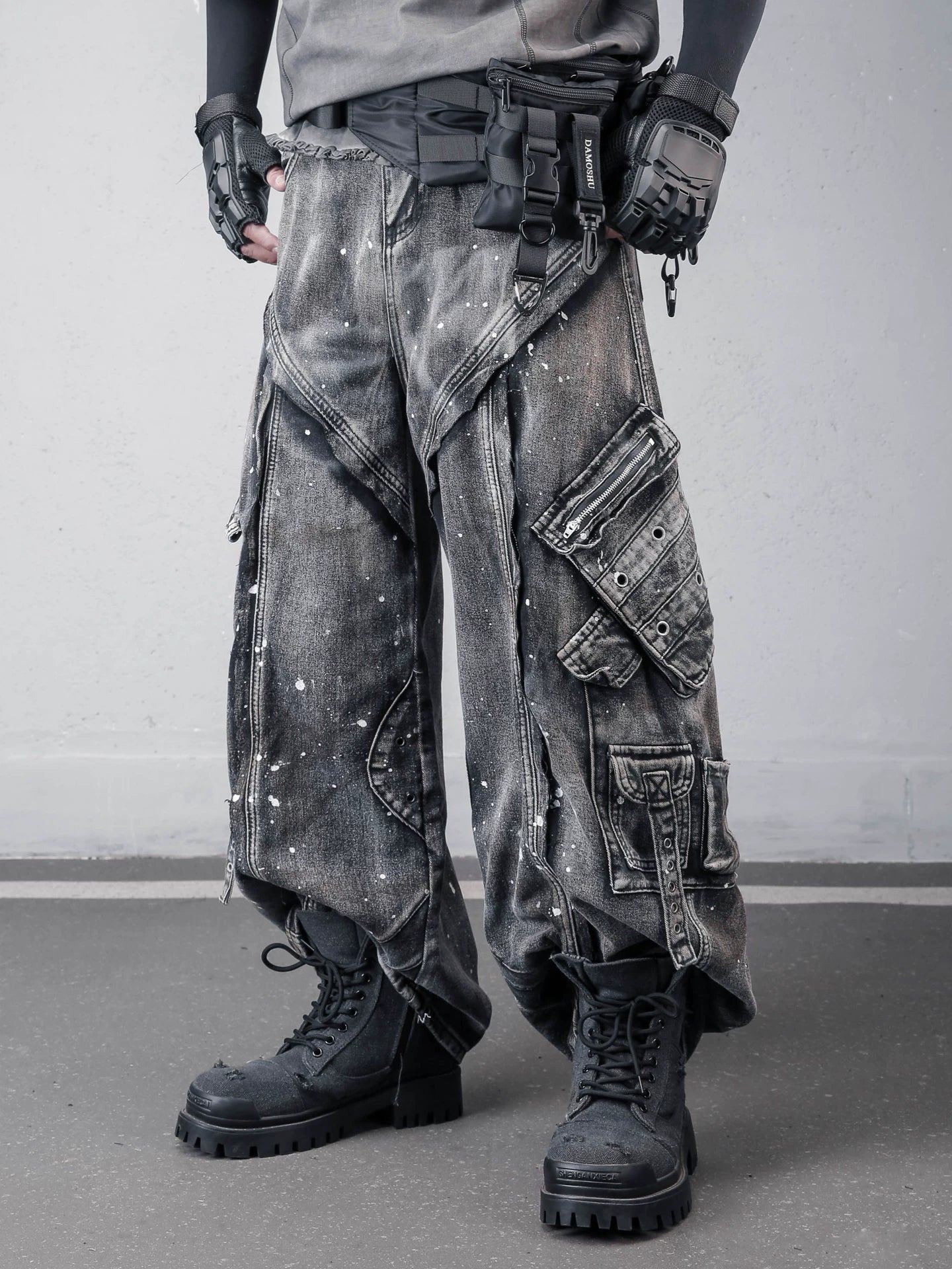 Sanhoostudio denim pants featuring paint splatter finish, multi-pocket design, and wide leg silhouette. Built for bold streetwear styling with a rugged aesthetic, functional details, and comfortable everyday wear.