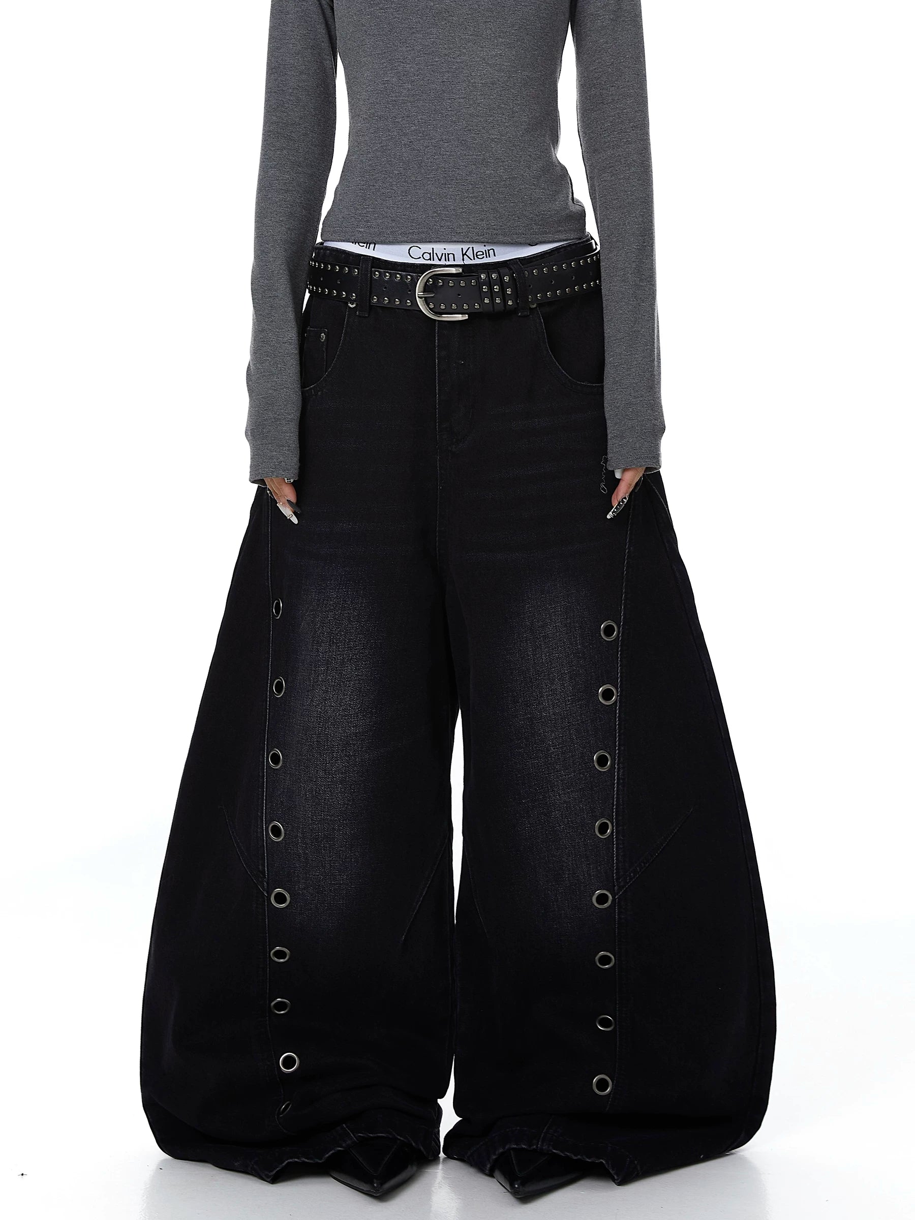 Sanhoostudio wide leg denim pants featuring cut-out structure and metal ring details. A bold deconstructed streetwear piece with distressed finish.