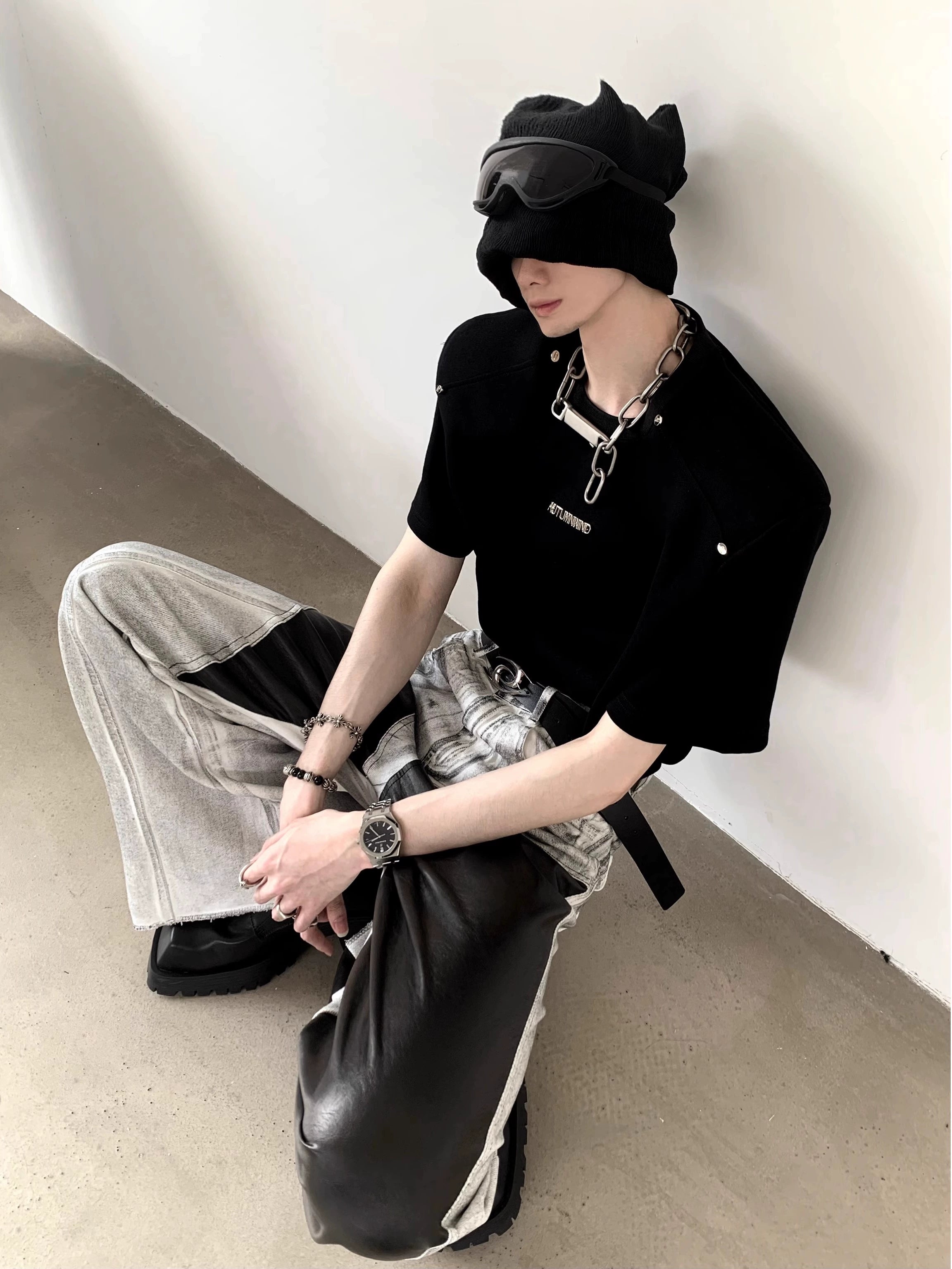 The Sanhoostudio distressed off-white jeans combine premium leather patchwork with a subtle flared cut. Their faded finish adds a rugged vintage vibe, while the unique detailing enhances versatility, making them a must-have for bold, high-fashion urban wardrobes.