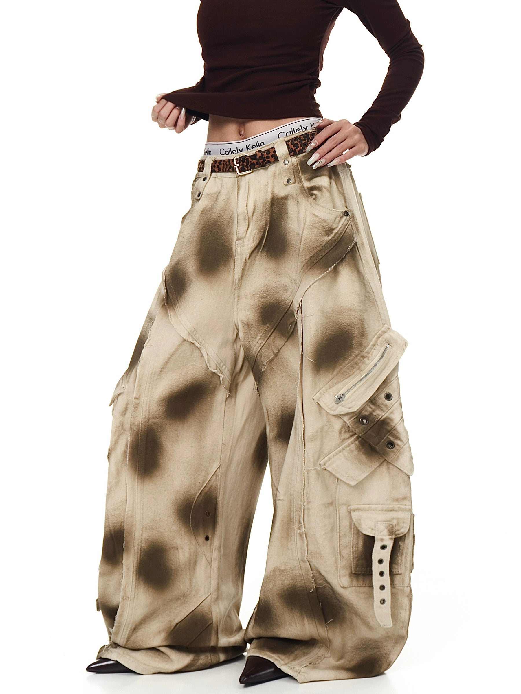 Sanhoostudio’s distressed dirty wash cargo pants combine high street aesthetics with a deconstructed wide leg silhouette, perfect for a grunge-inspired wardrobe.