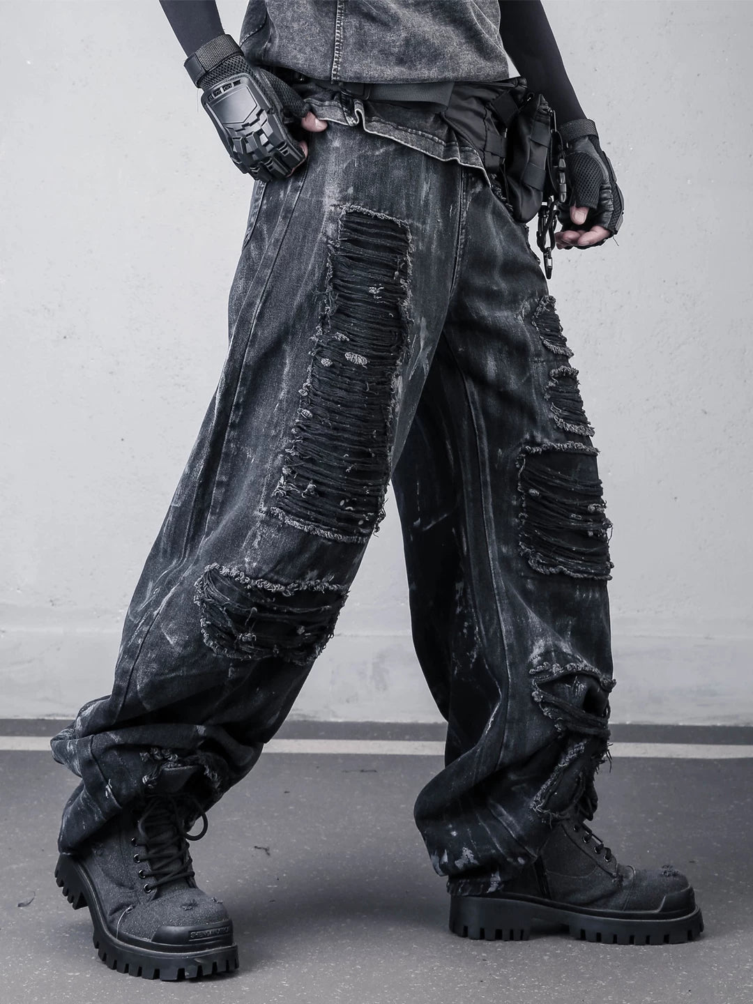 Sanhoostudio wide leg denim pants featuring distressed wash, painted effect, and ripped detailing. Designed with a scythe-cut silhouette for bold streetwear outfits, combining comfort, texture, and everyday versatility.