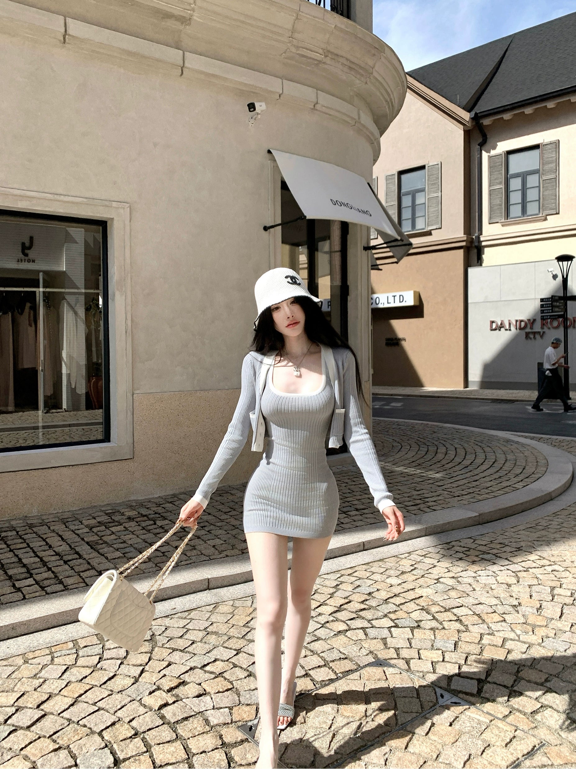 Sanhoostudio presents the Knit Cardigan Dress Set, a fashionable two-piece combining comfort and elegance for effortless autumn wear.