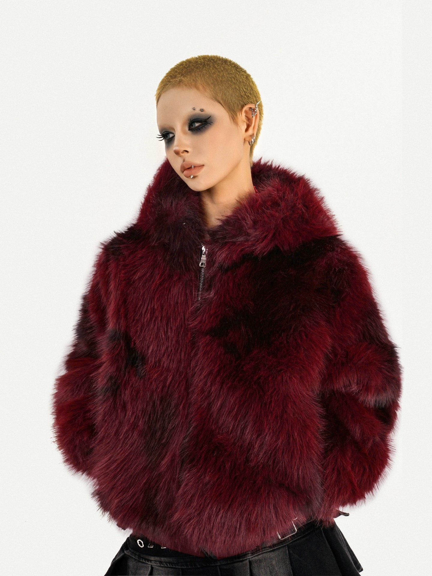 Sanhoostudio’s red furry jacket combines warmth and attitude in a striking hooded silhouette—an essential piece for bold winter street styling.