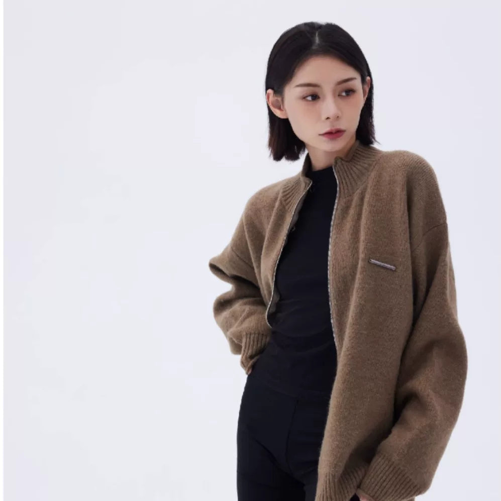 Sanhoostudio knit cardigan with rolled hem detail and relaxed fit. A unisex piece designed for daily wear and layering.