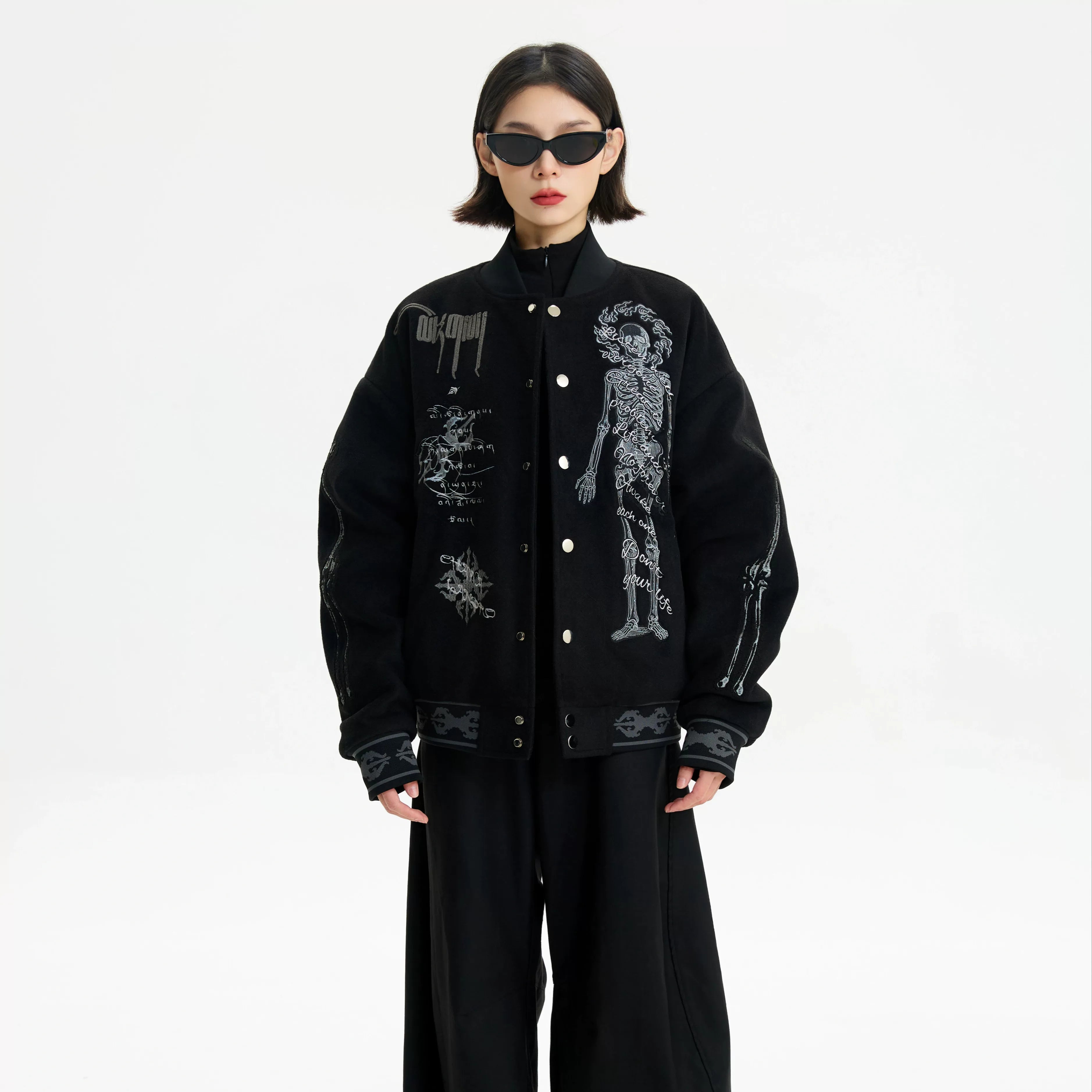 Sanhoostudio heavyweight varsity jacket with embroidery and warm construction. Designed for unisex winter streetwear.