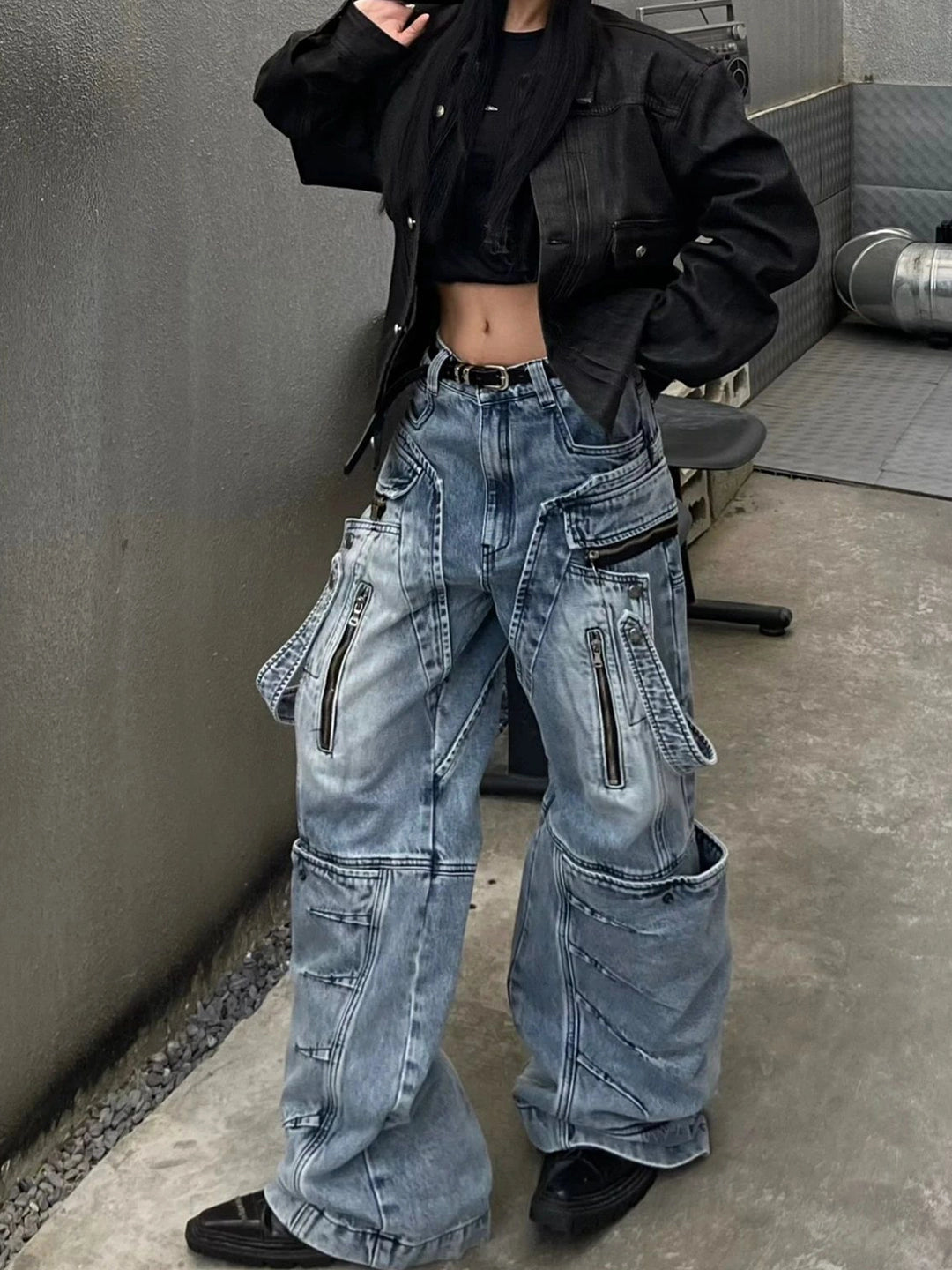 These heavy-duty cargo pants from Sanhoostudio combine deconstructed patchwork with multi-pocket functionality, delivering rugged streetwear style in a wide-leg floor-length cut. A bold fashion-forward piece.